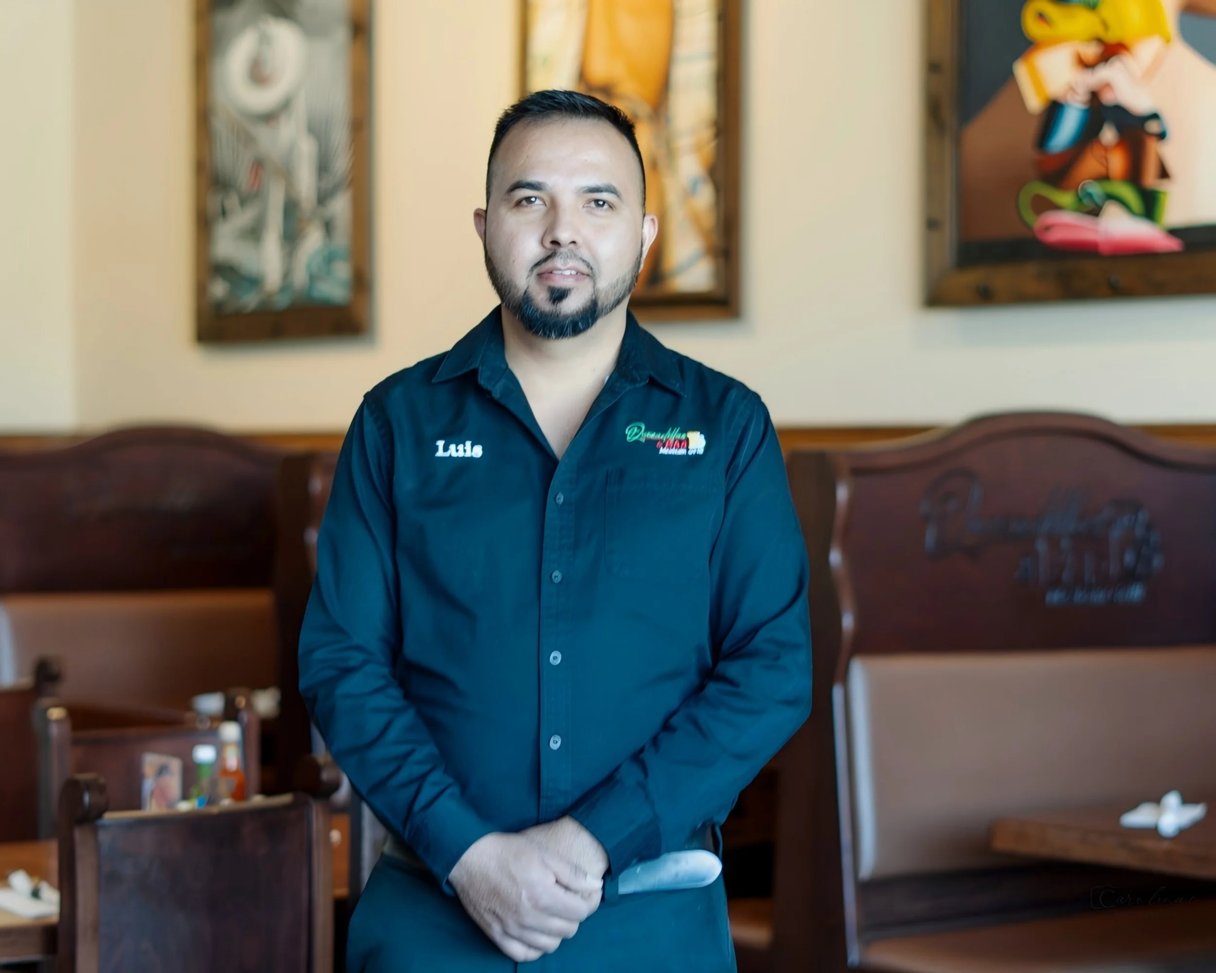 Restaurant staff member in a cozy dining area