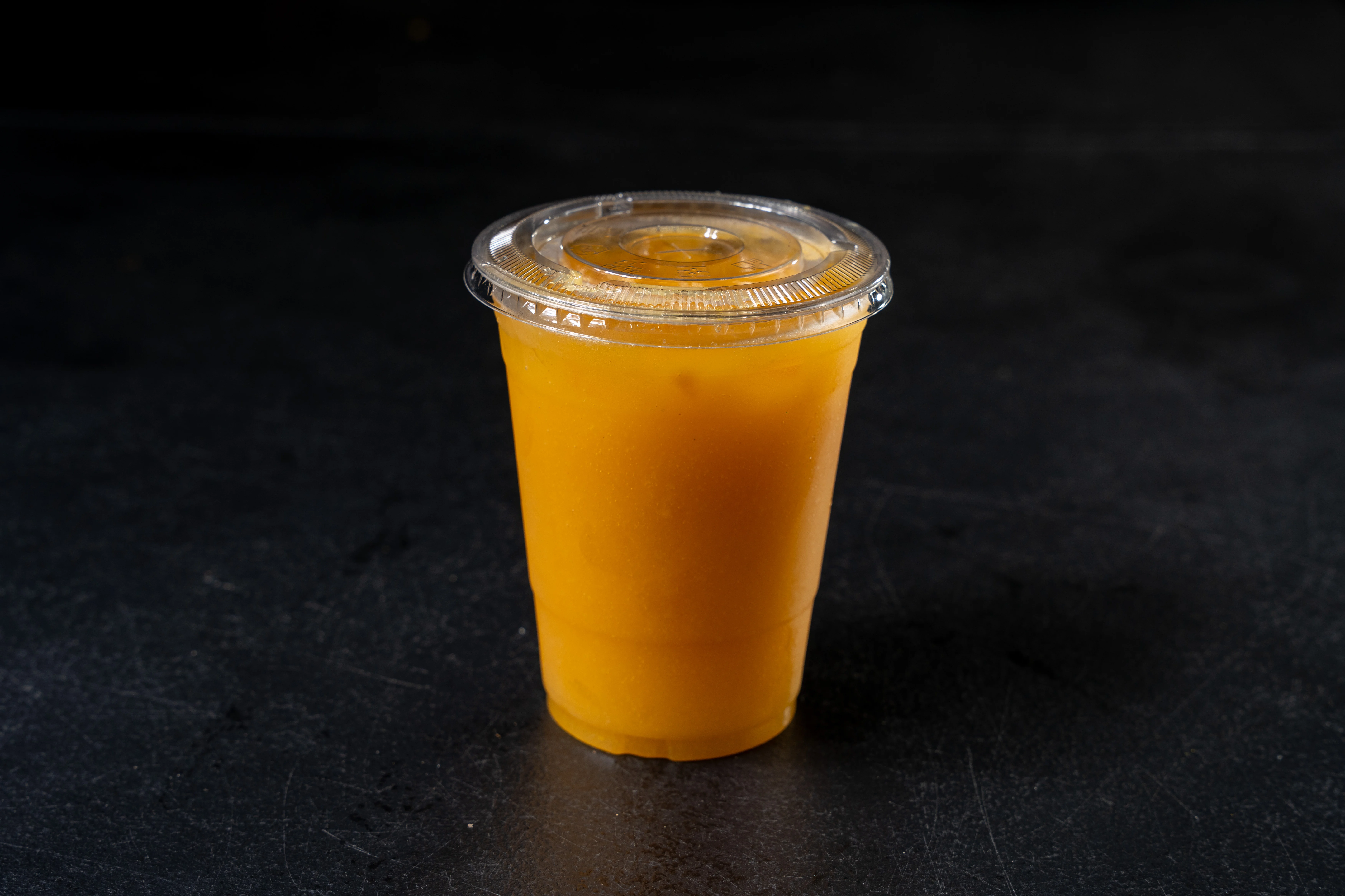 Refreshing mango juice in a clear cup