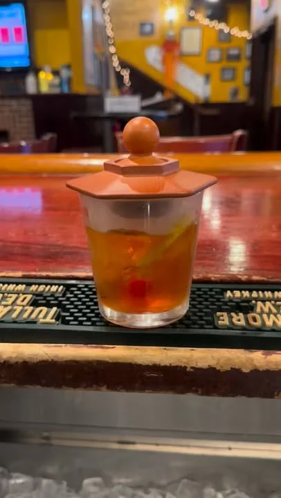 Classic cocktail served in a decorative glass with lid