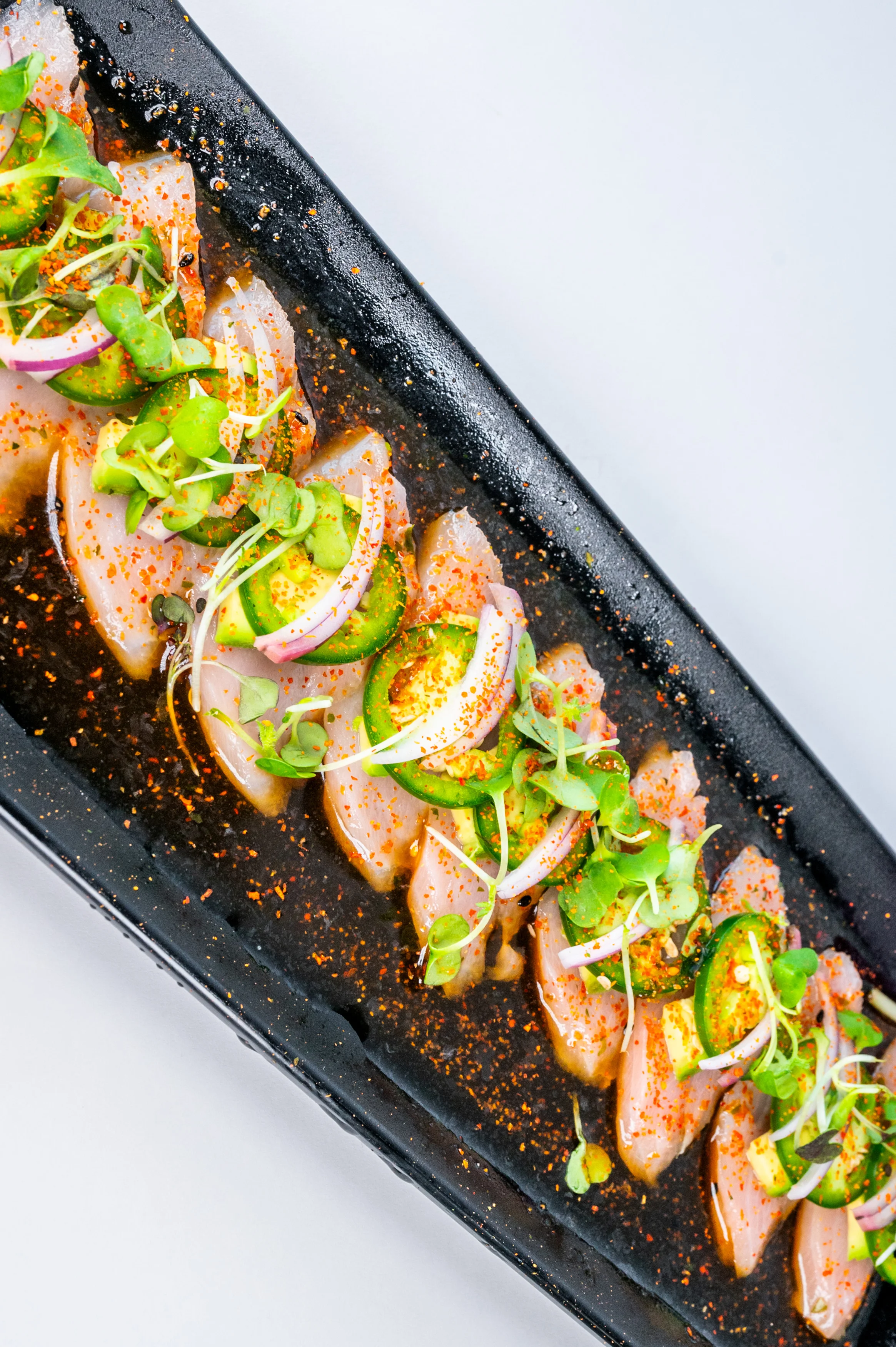 Japanese sashimi platter with fresh fish and garnishes