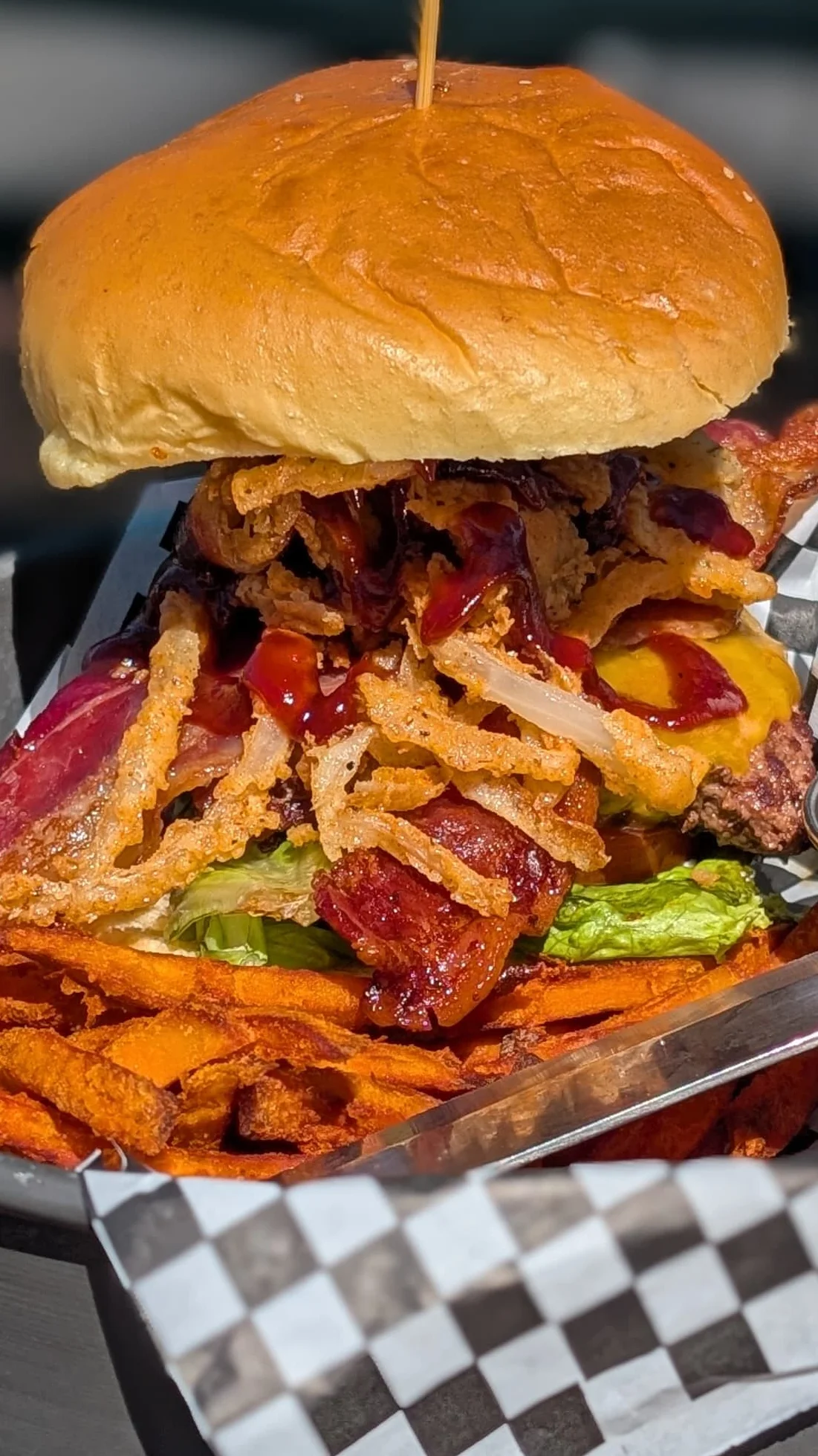 Loaded BBQ bacon burger with sweet potato fries