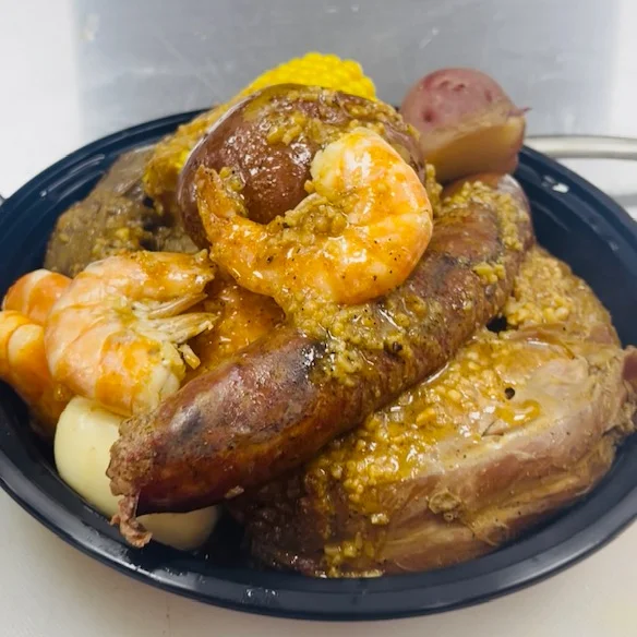 Seafood boil with shrimp, sausage, and corn