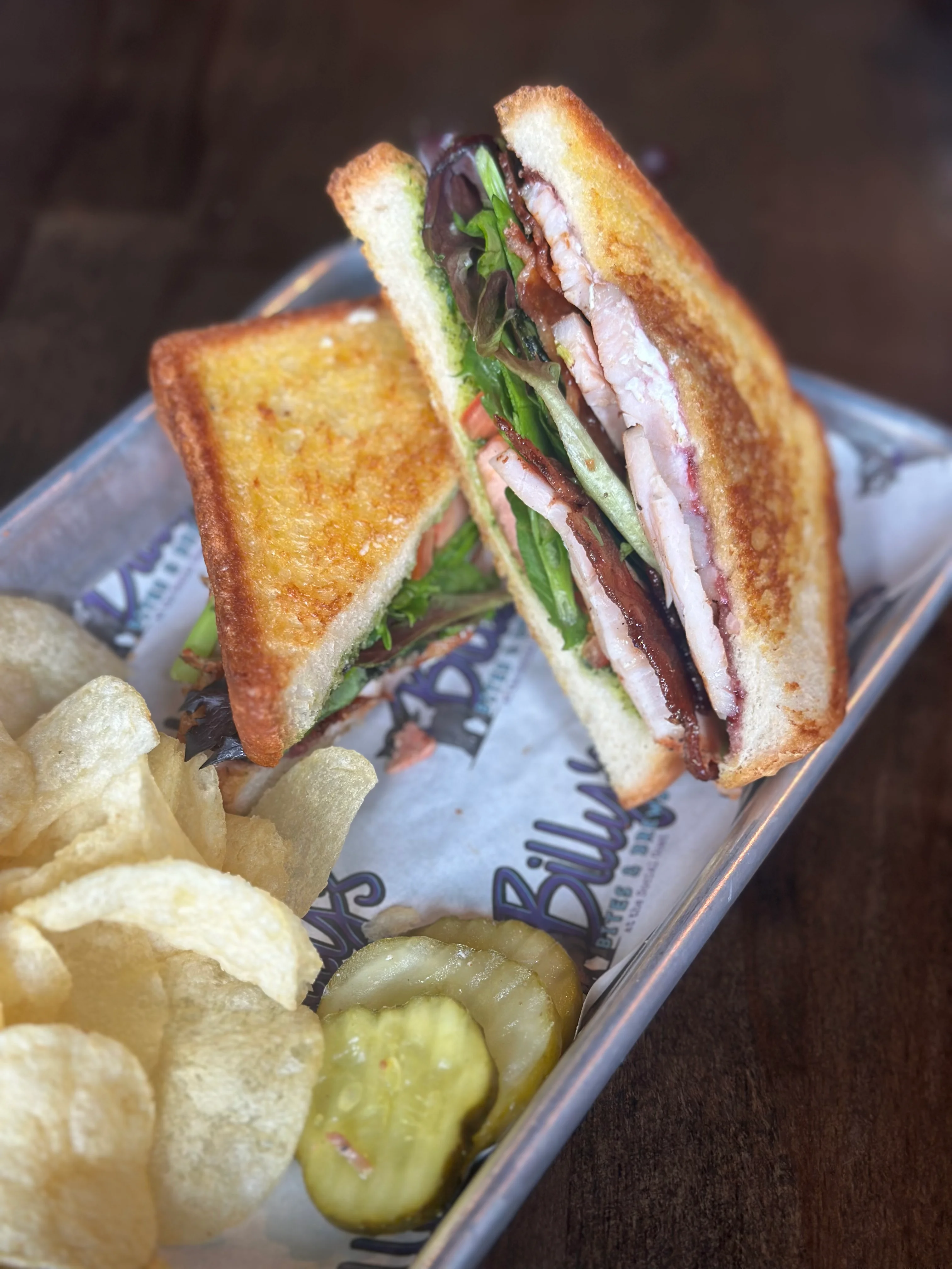 Classic club sandwich with crispy bread and fresh greens