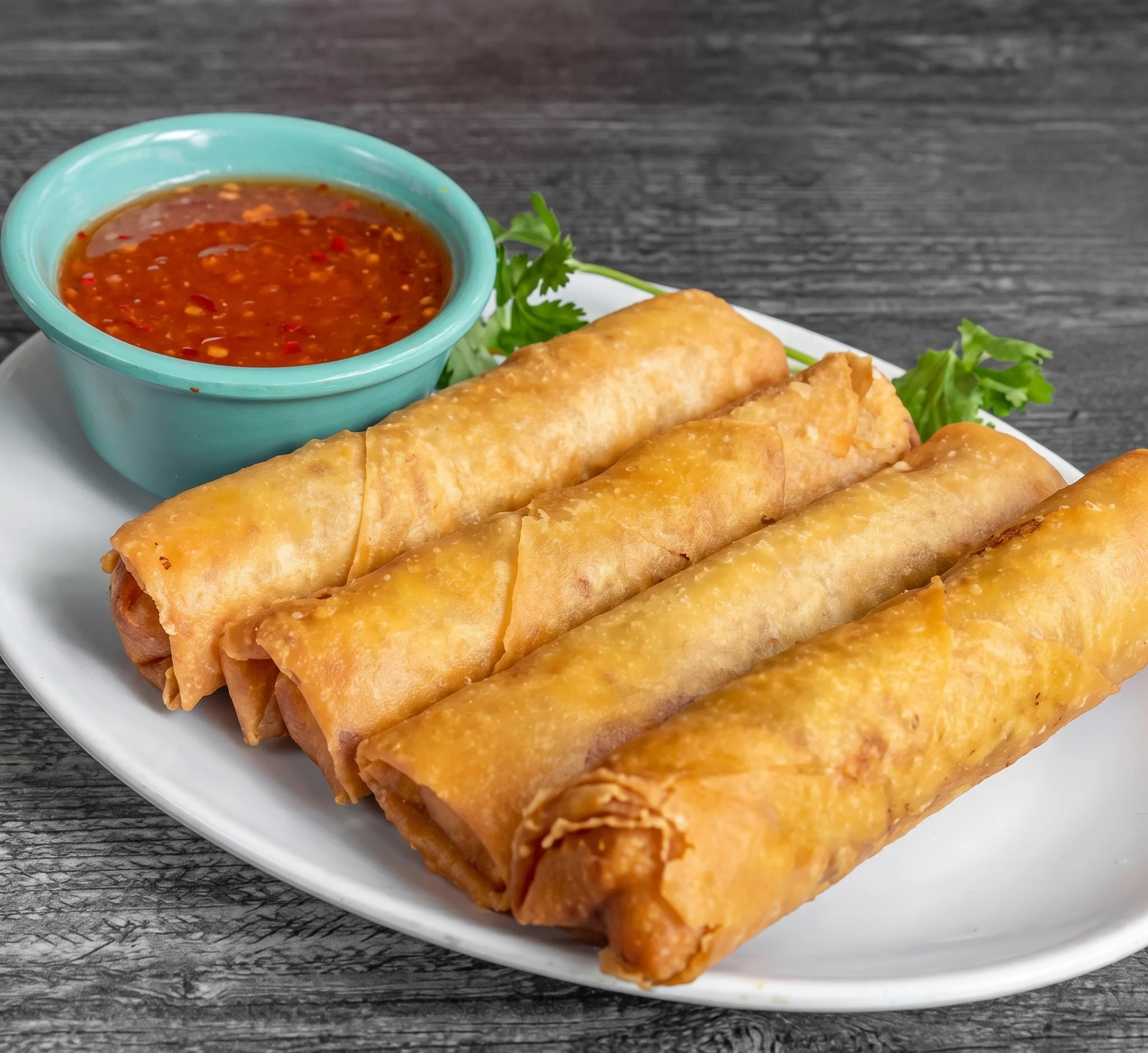 Crispy Thai spring rolls with sweet chili sauce