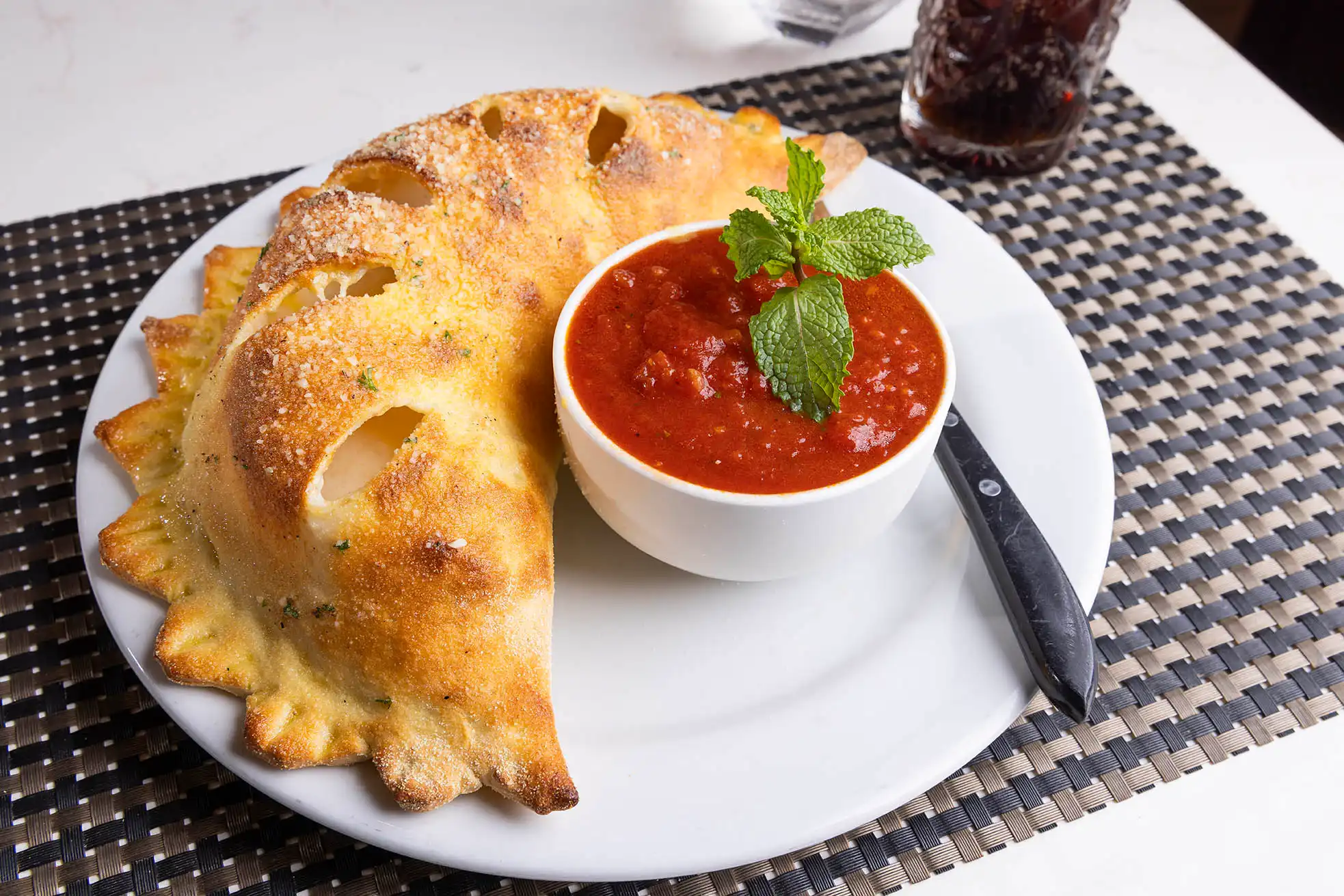 Cucina fresh mozzarella cheese calzone with marinara sauce