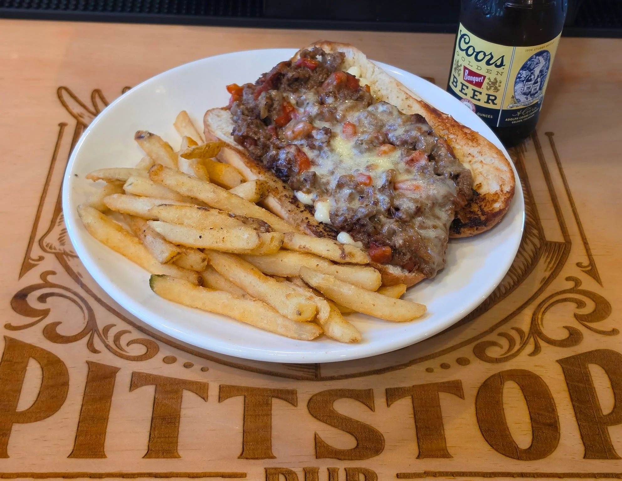 Delicious gourmet burger with fresh toppings on a wooden table