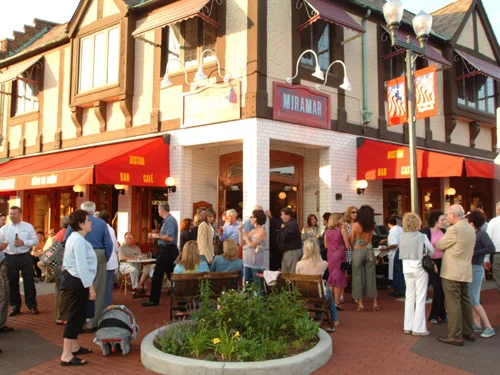 Charming restaurant exterior with outdoor seating and vibrant signage