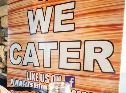 A sign letting people know that Bobbee O's offers catering