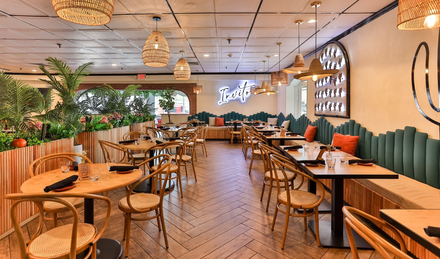 Stylish restaurant interior with greenery and modern decor
