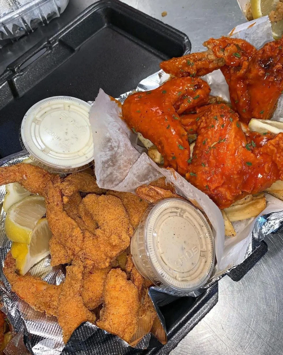 Crispy fried shrimp and buffalo wings platter