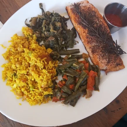Grilled salmon with seasoned rice and sautéed greens