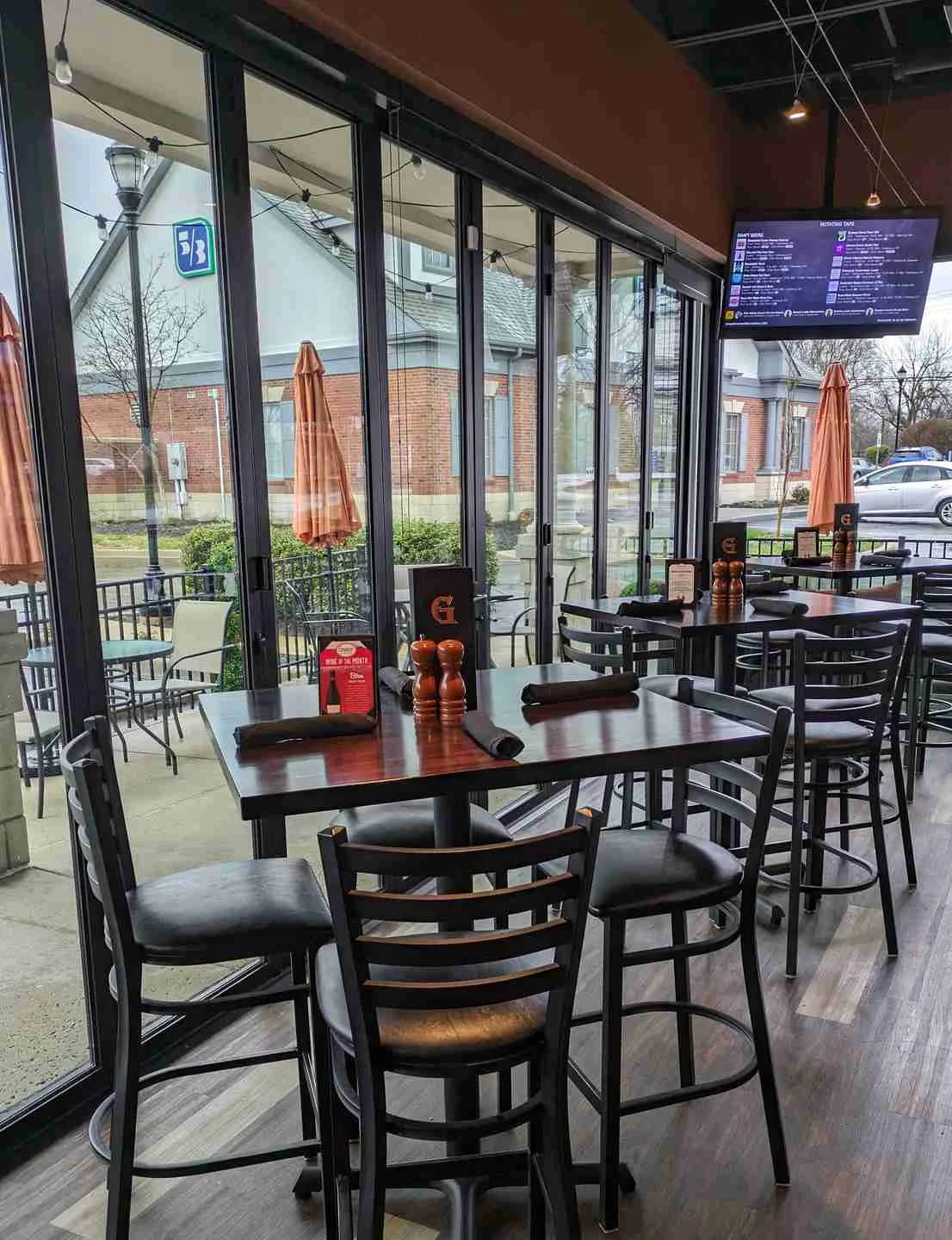 Modern restaurant interior with large windows and seating