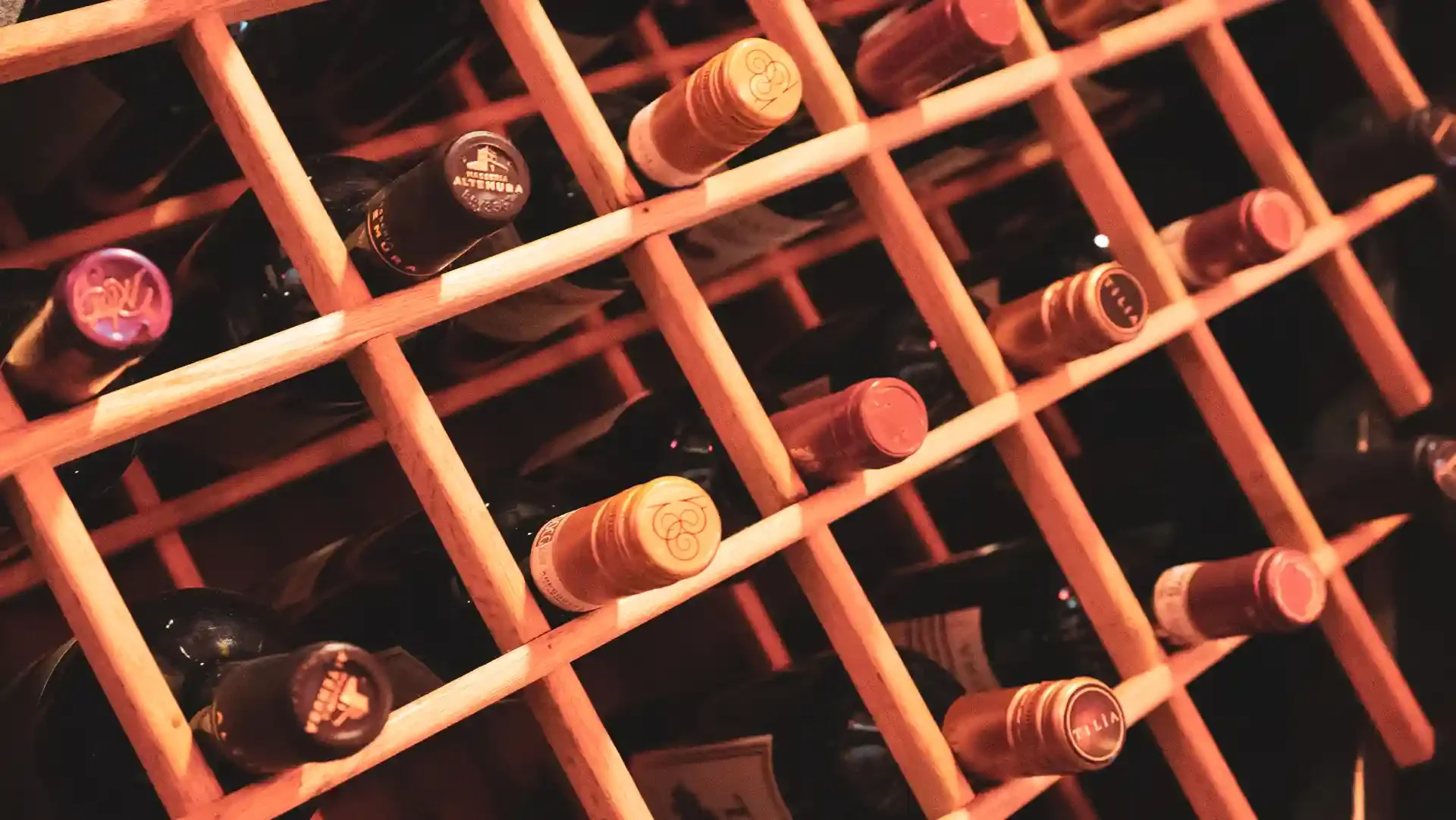 Wine bottles arranged in a wooden rack
