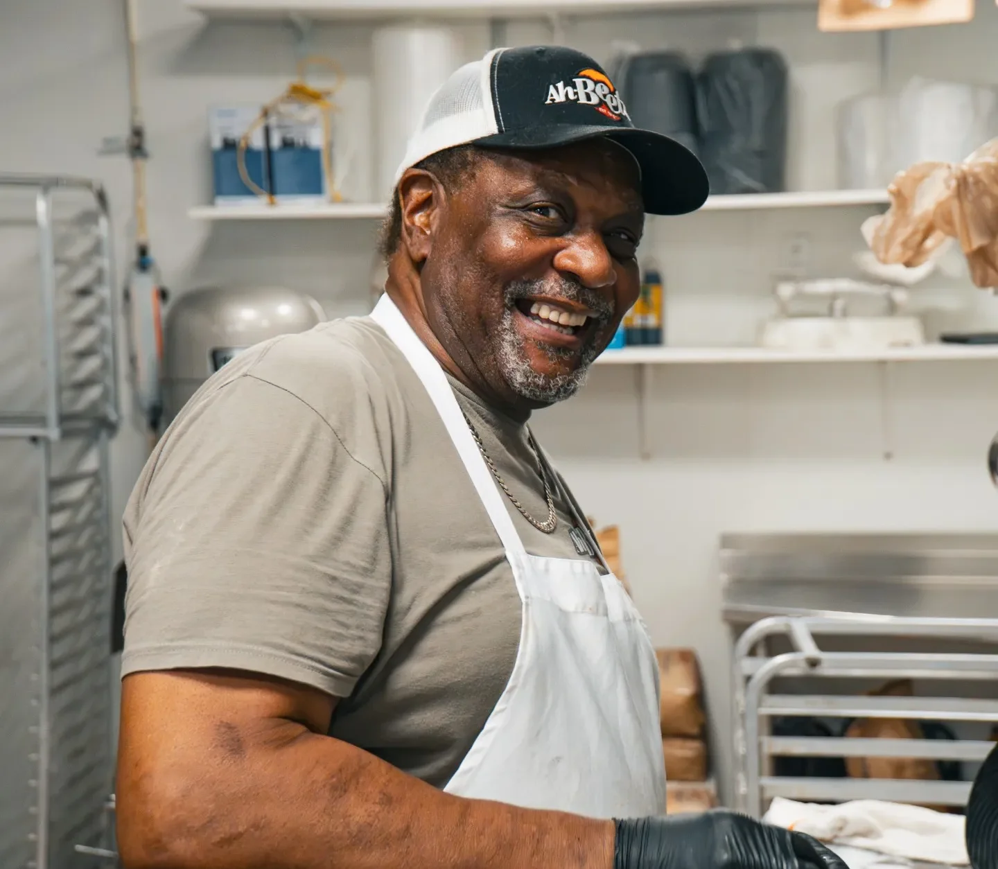 A happy, smiling employee at Ah Beetz