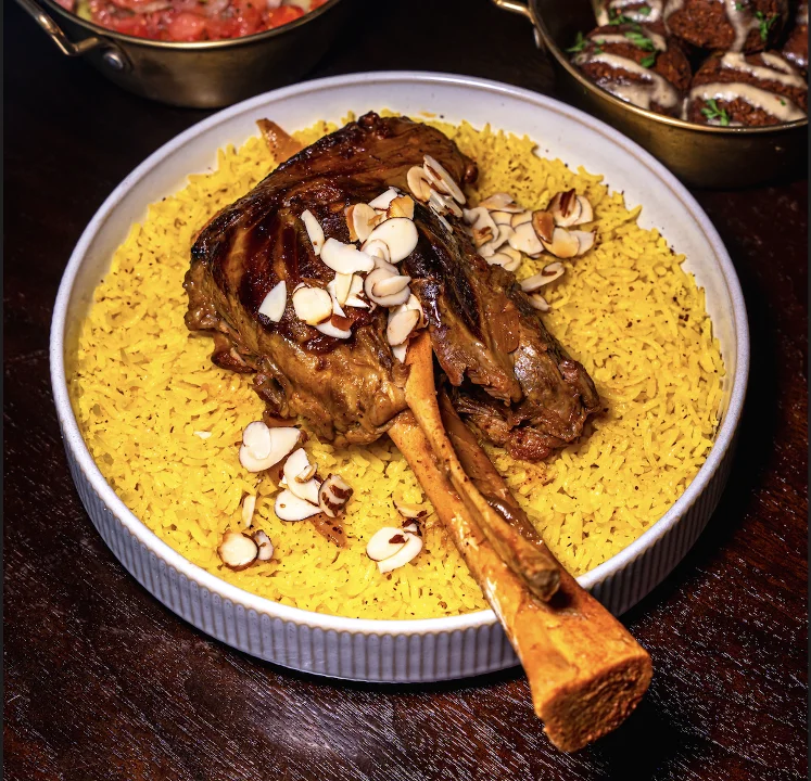 The Grand MENA Feast catering package from Tripoli's, featuring slow-cooked halal lamb