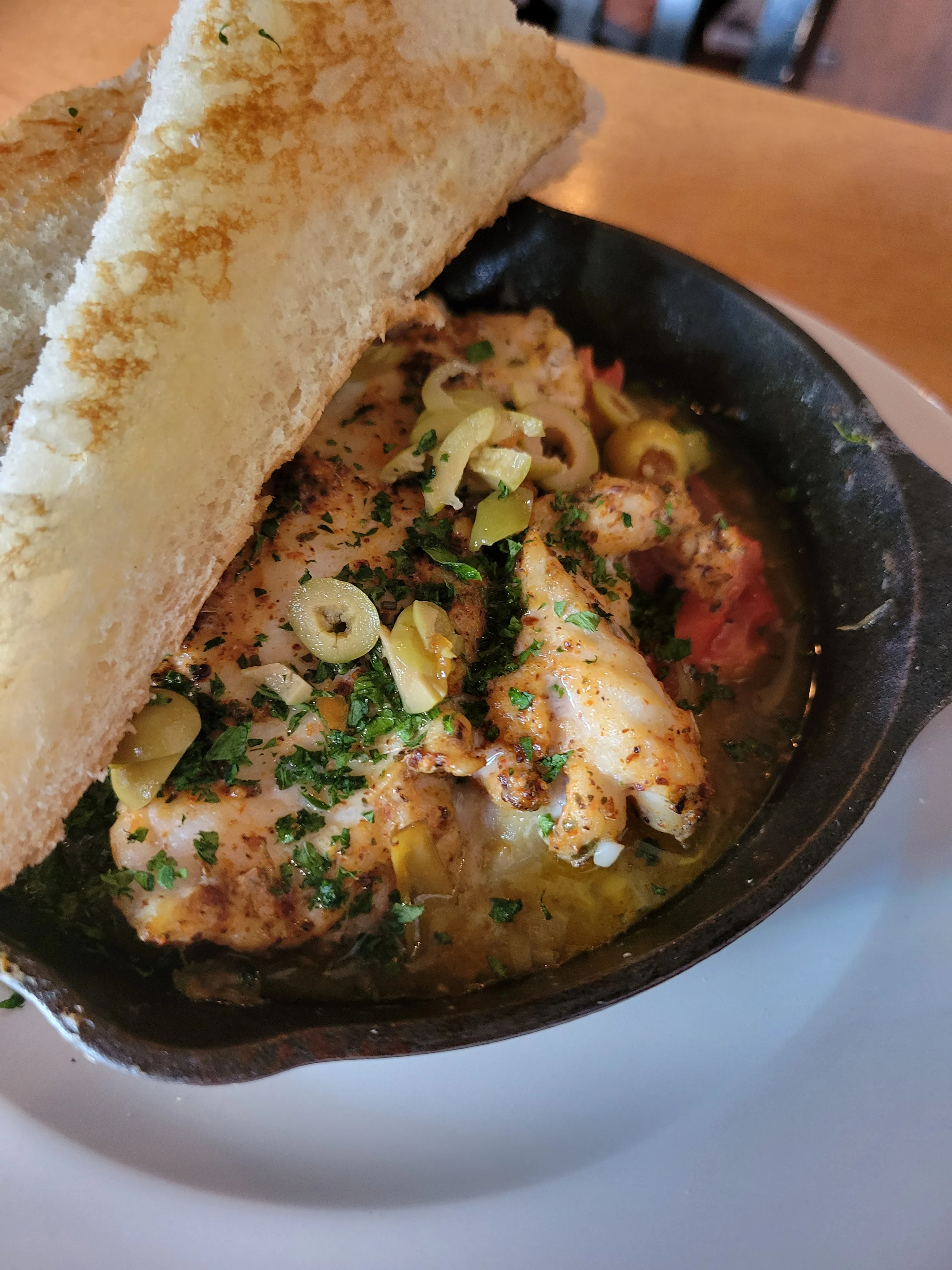 Mediterranean style haddock in a cast iron skillet
