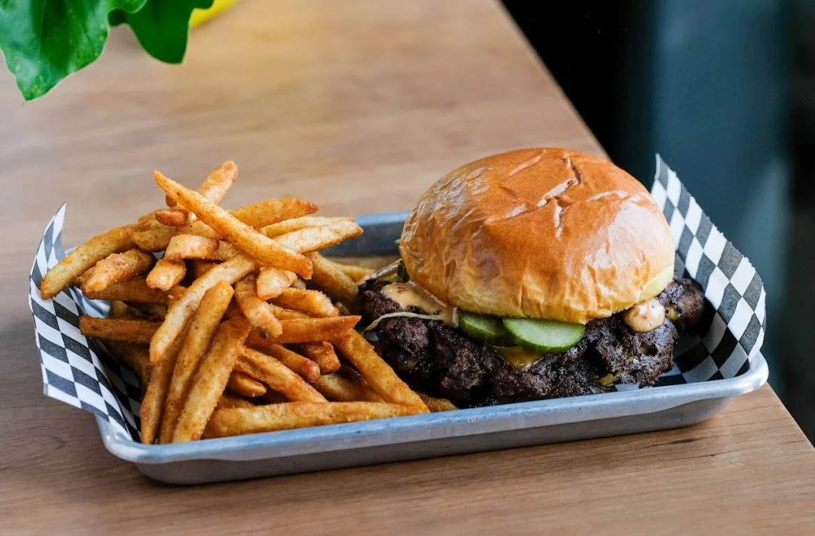 Juicy American cheeseburger with fries