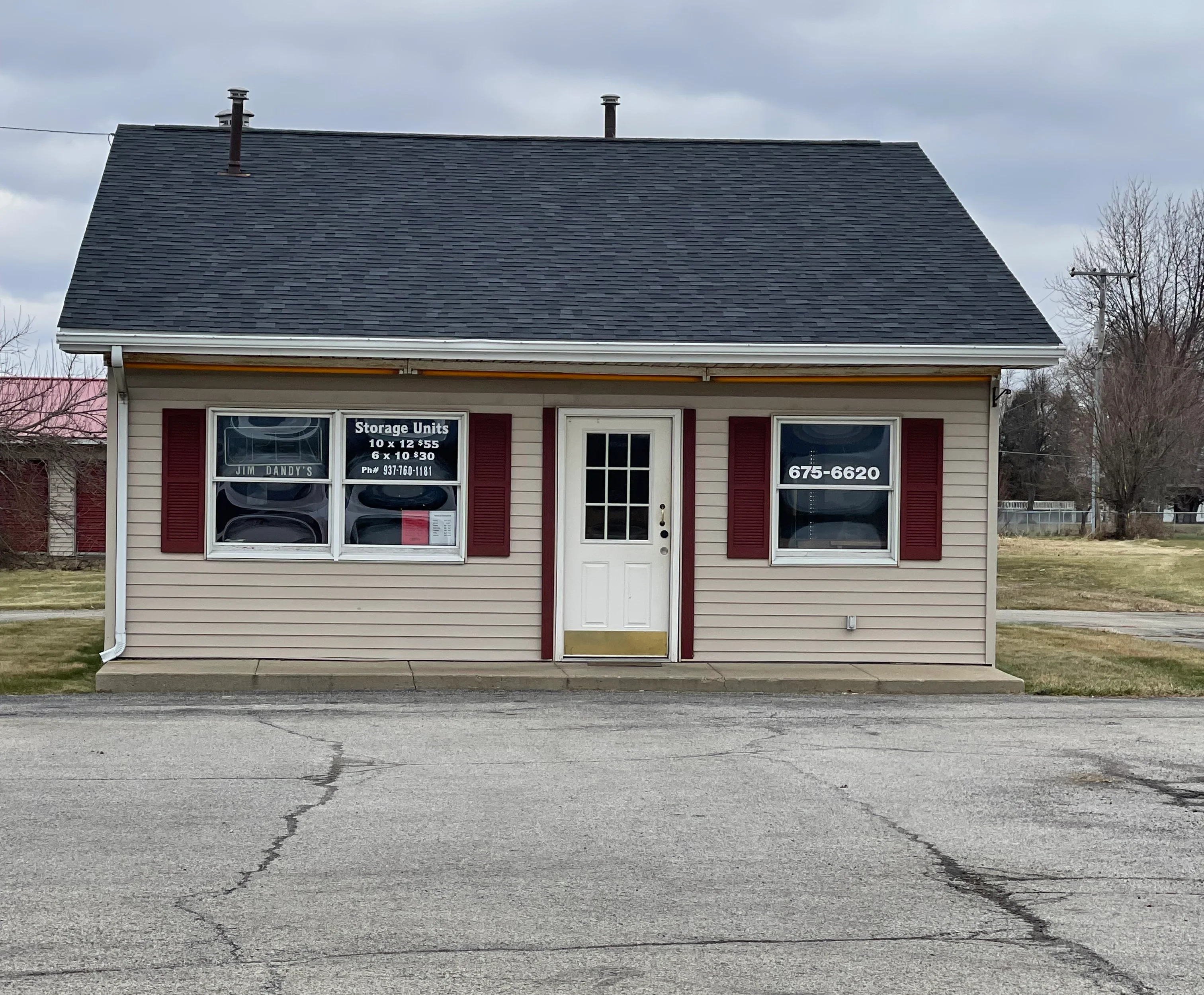 Exterior view of a storage unit facility with signage