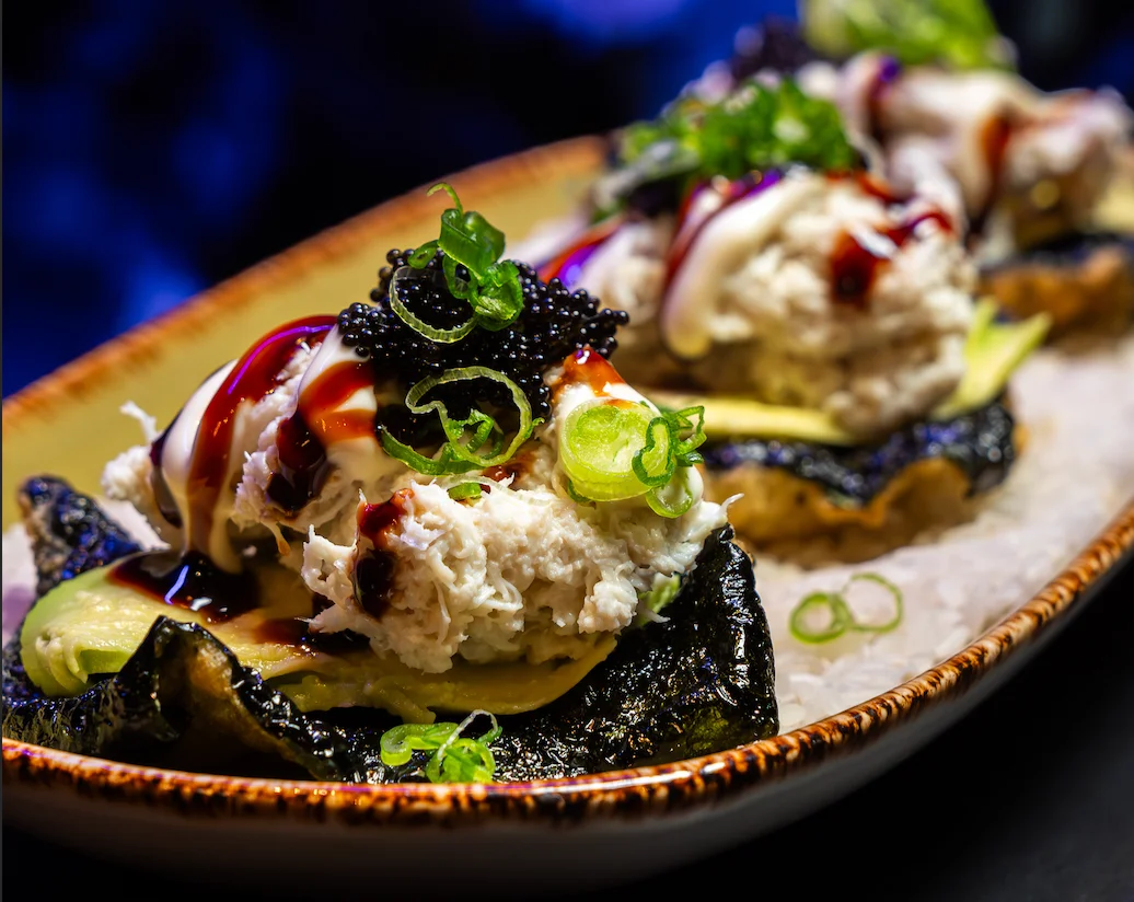 Japanese crab sushi on nori with toppings