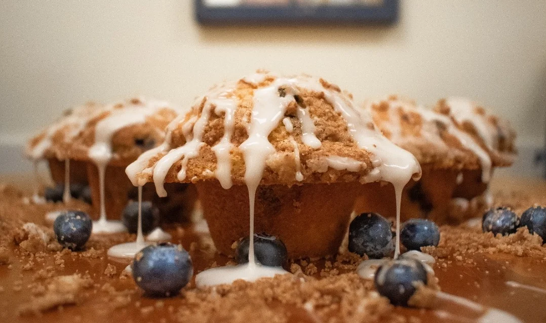 Blueberry muffins with crumb topping and glaze