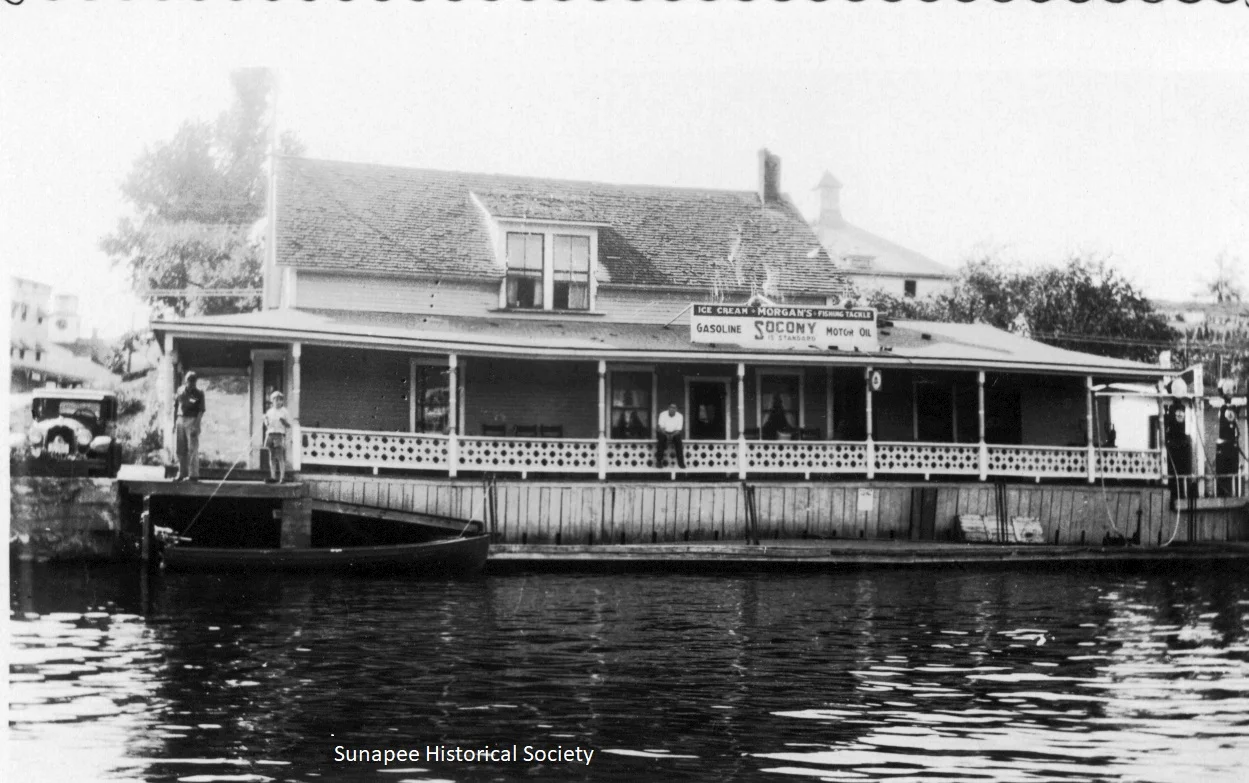 Historic lakeside building with fishing tackle and ice cream sign