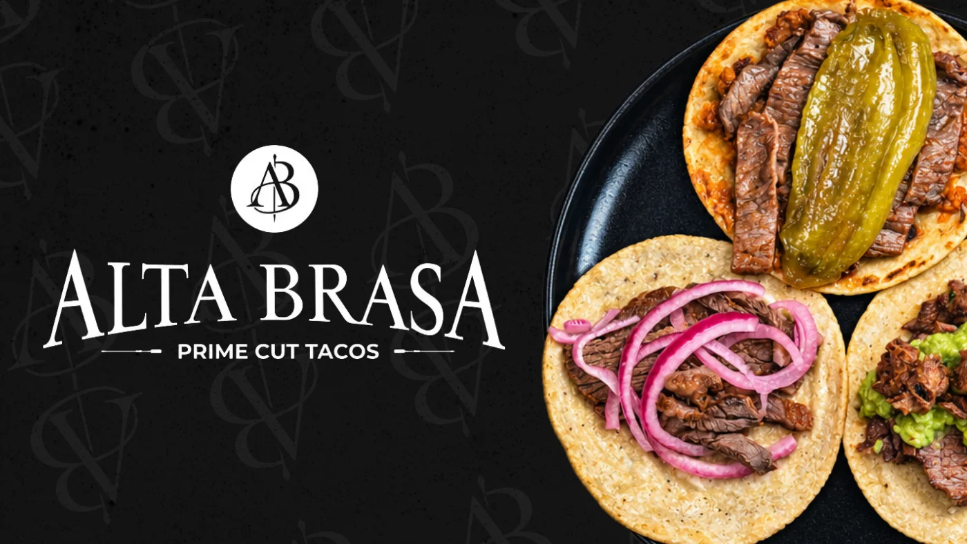 Prime cut Mexican tacos arranged on a black plate