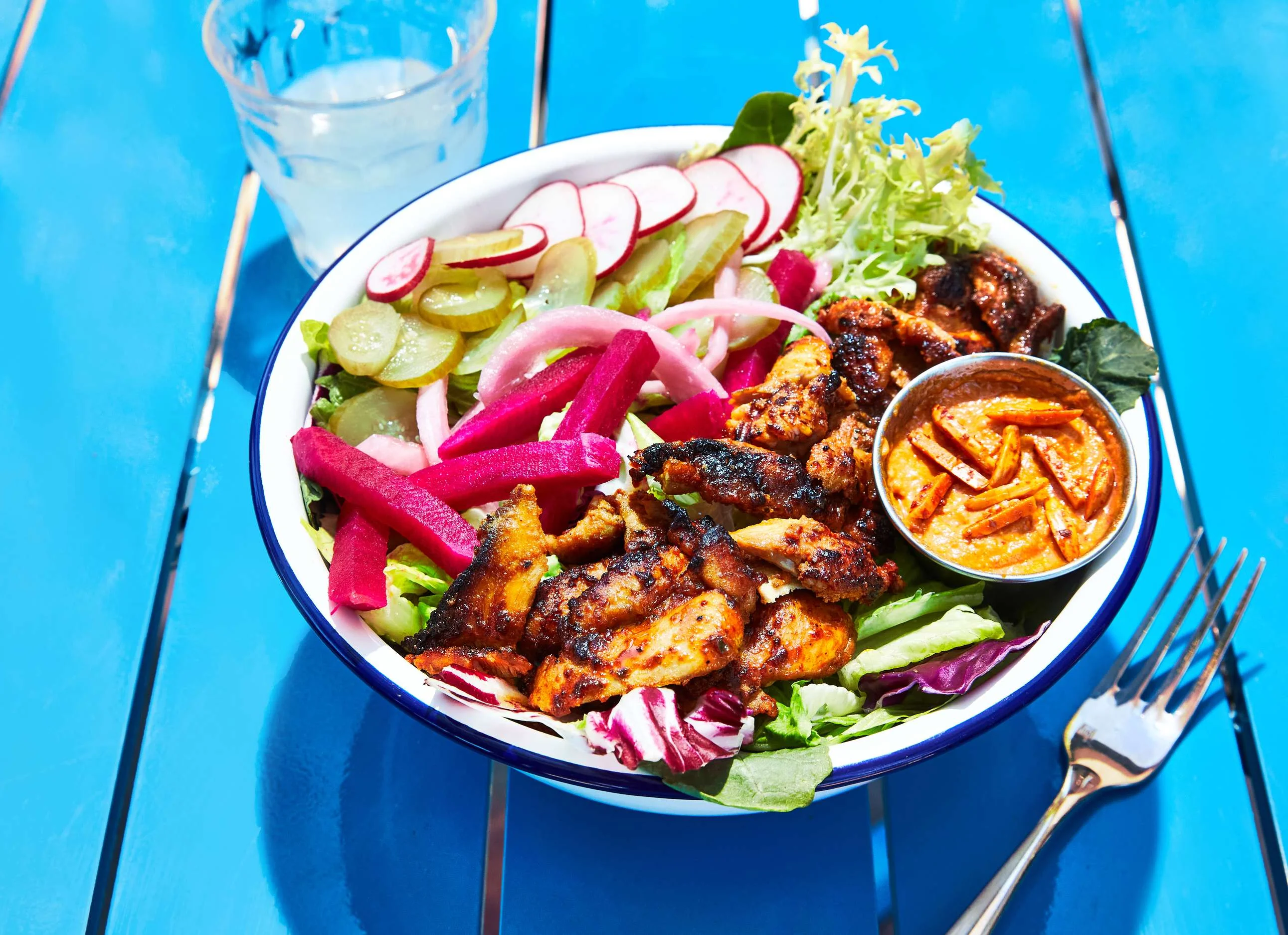 Grilled chicken salad with vibrant vegetables