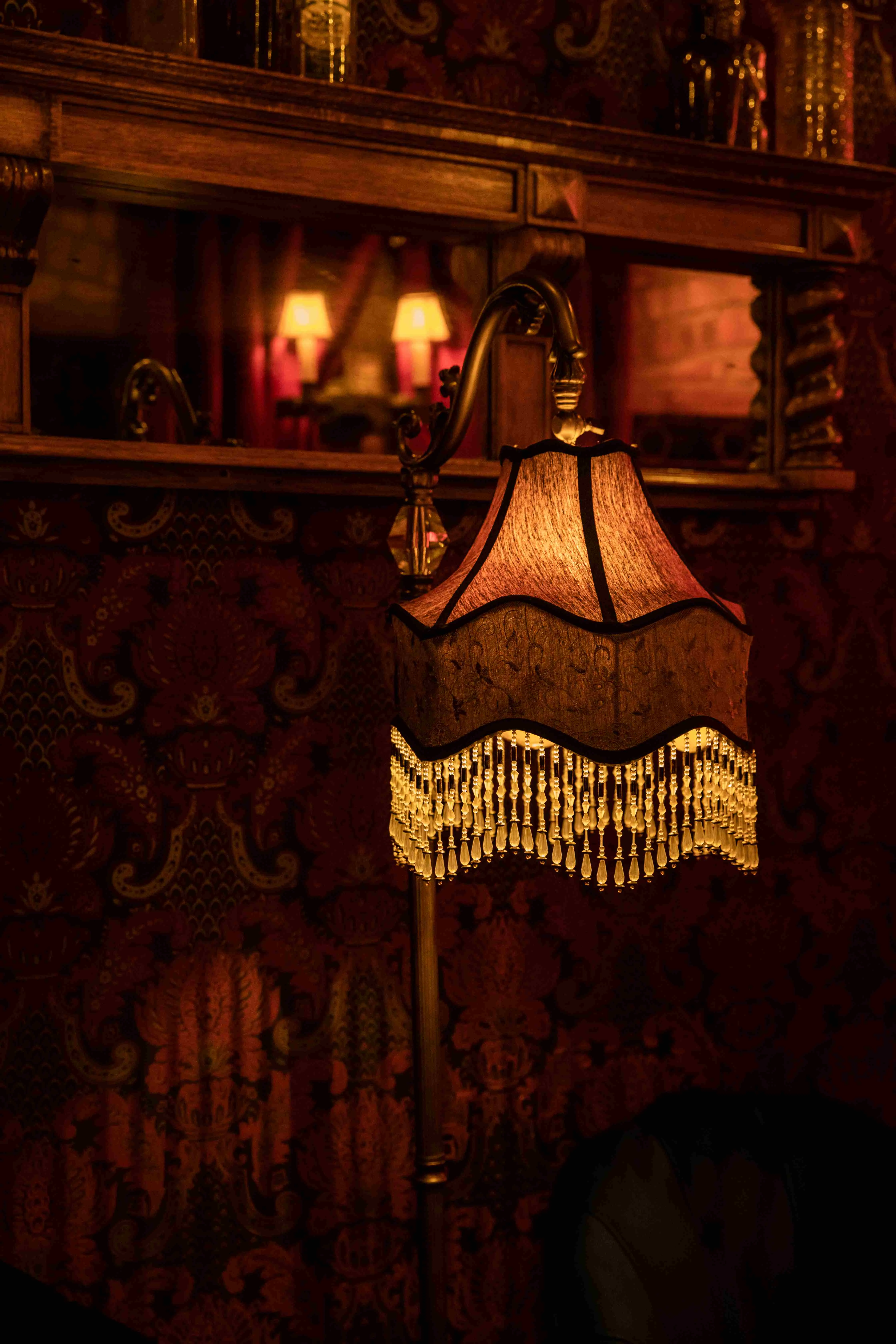 Elegant vintage lamp with crystal fringe in a cozy restaurant setting