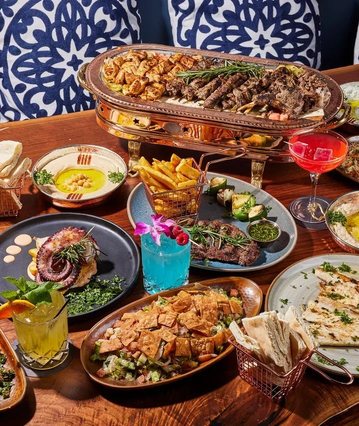 Delicious shawarma platter with fresh vegetables and sauces