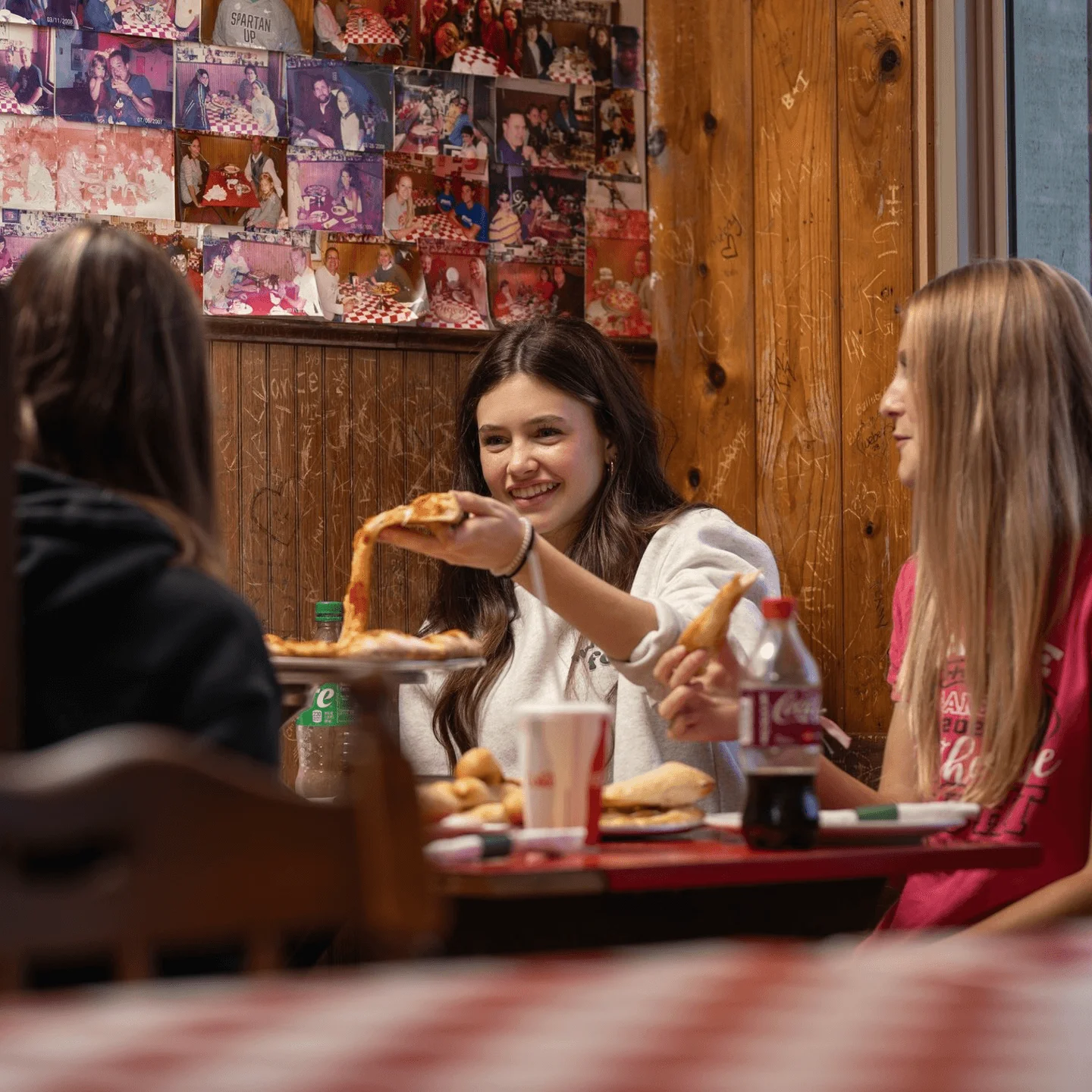 A group of friends eating pizza