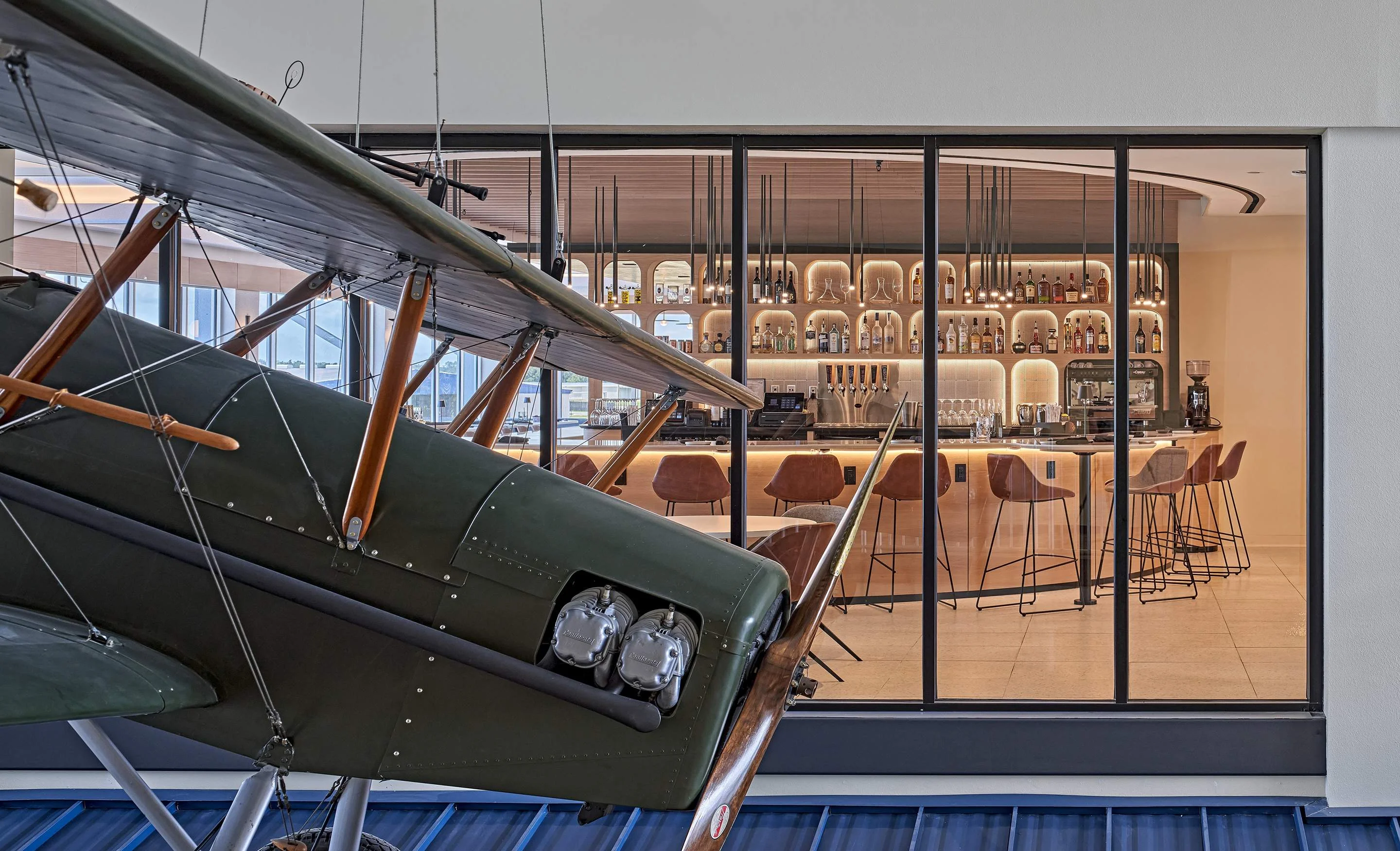 Modern bar interior with vintage airplane decor
