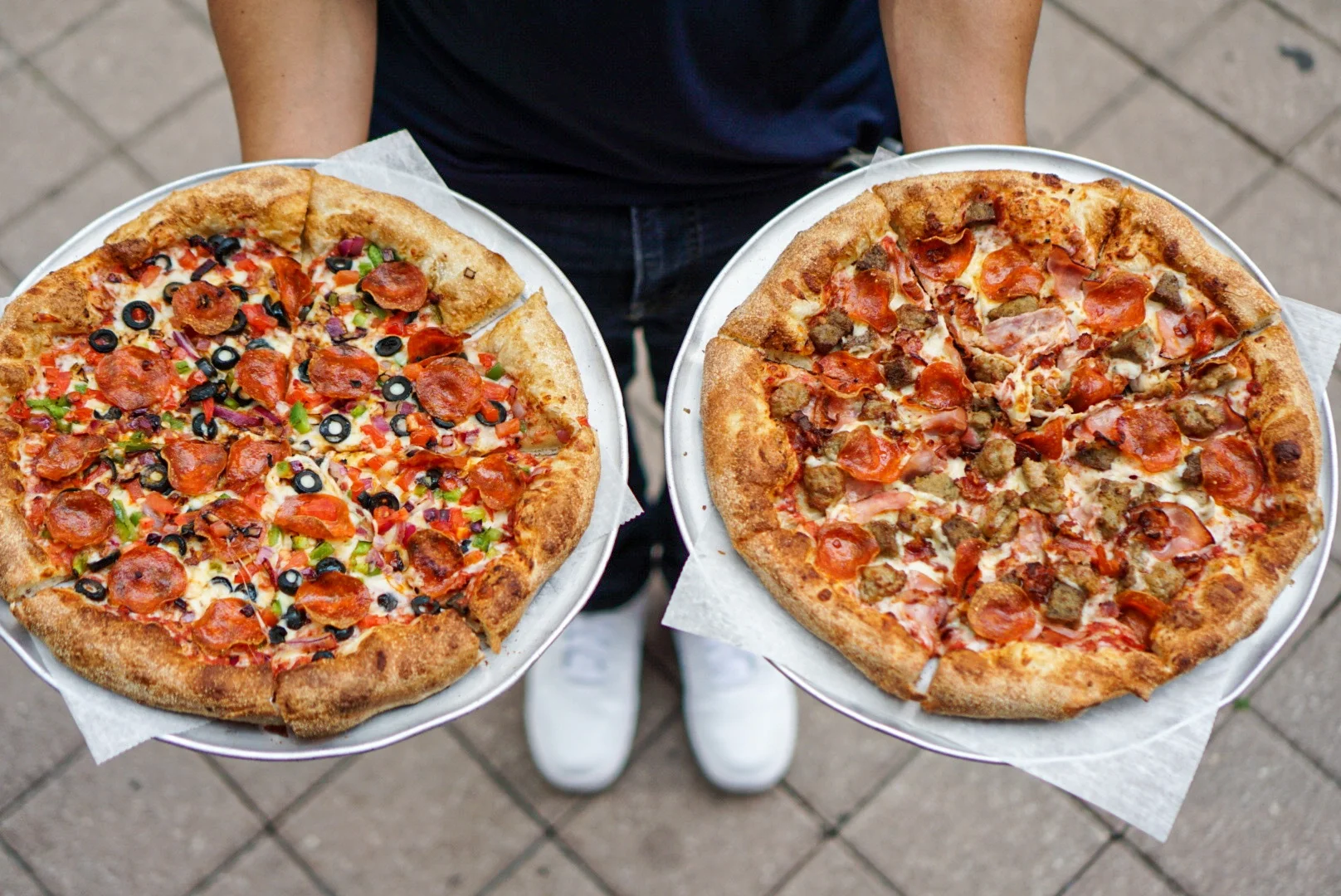 Two delicious pizzas: pepperoni and meat lovers