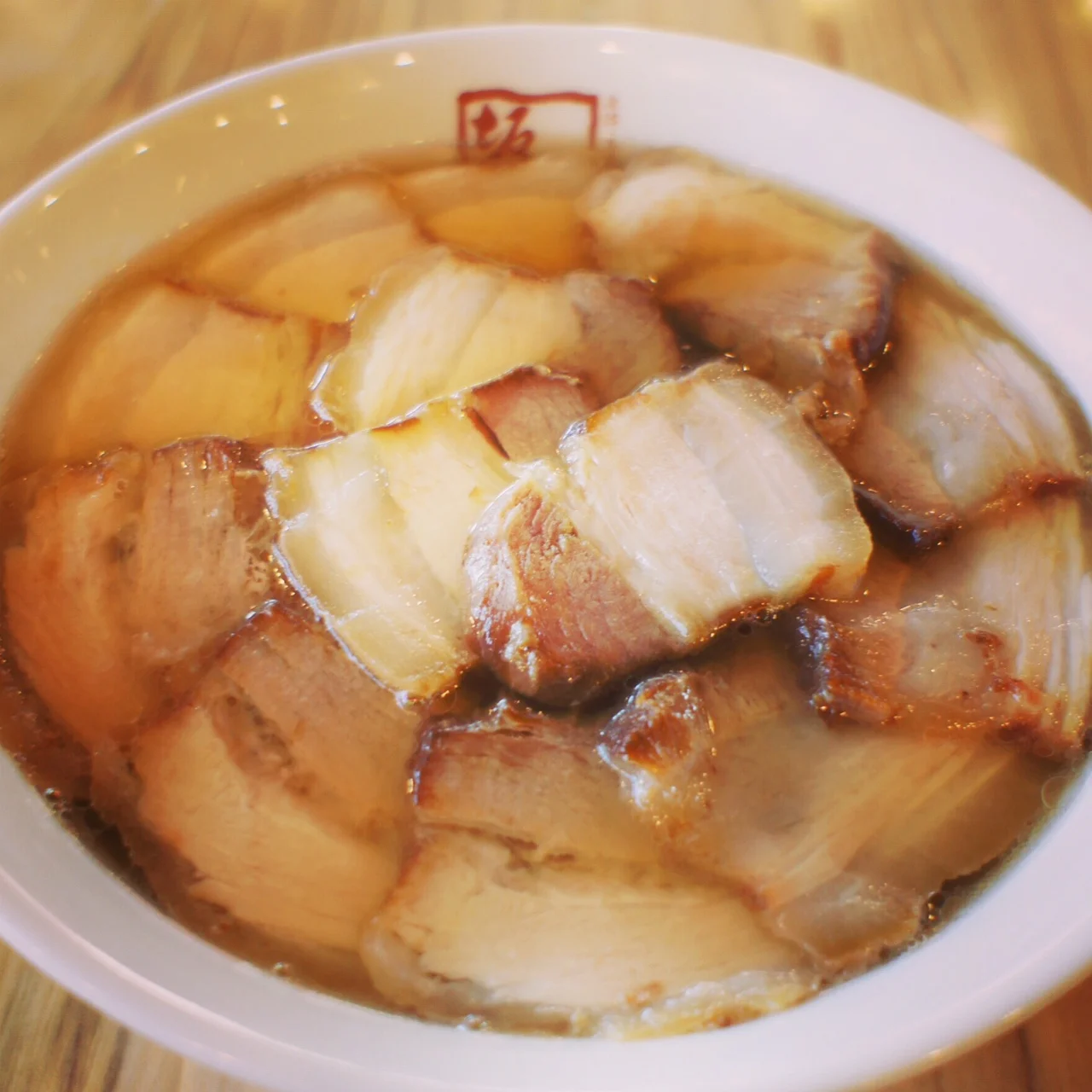 A bowl of Kitakata Chashu Ramen with toppings and broth.