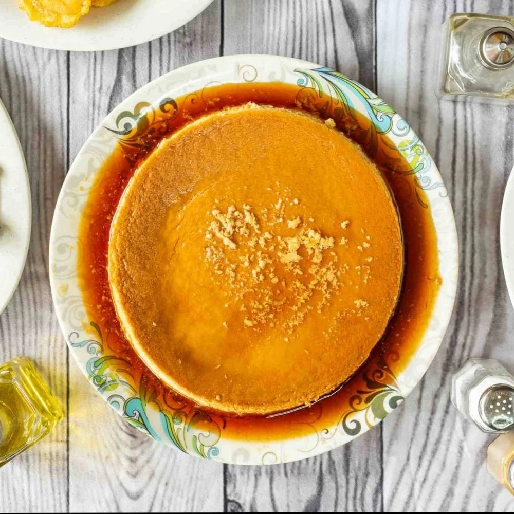 Flan de leche served on a decorative plate