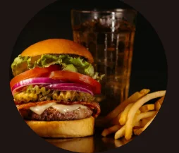 Juicy American cheeseburger with fries and soda