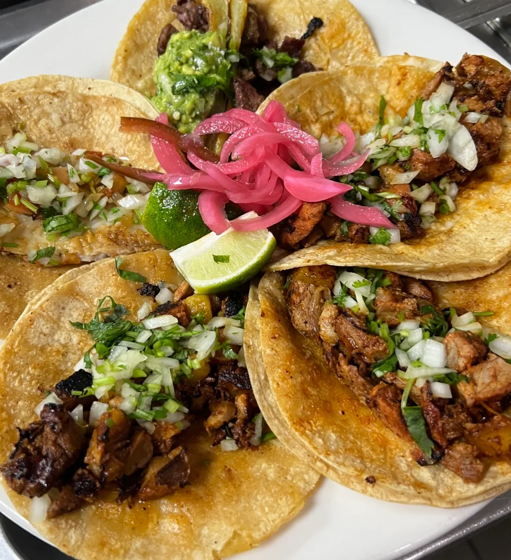 Authentic Mexican tacos with grilled meats and fresh toppings