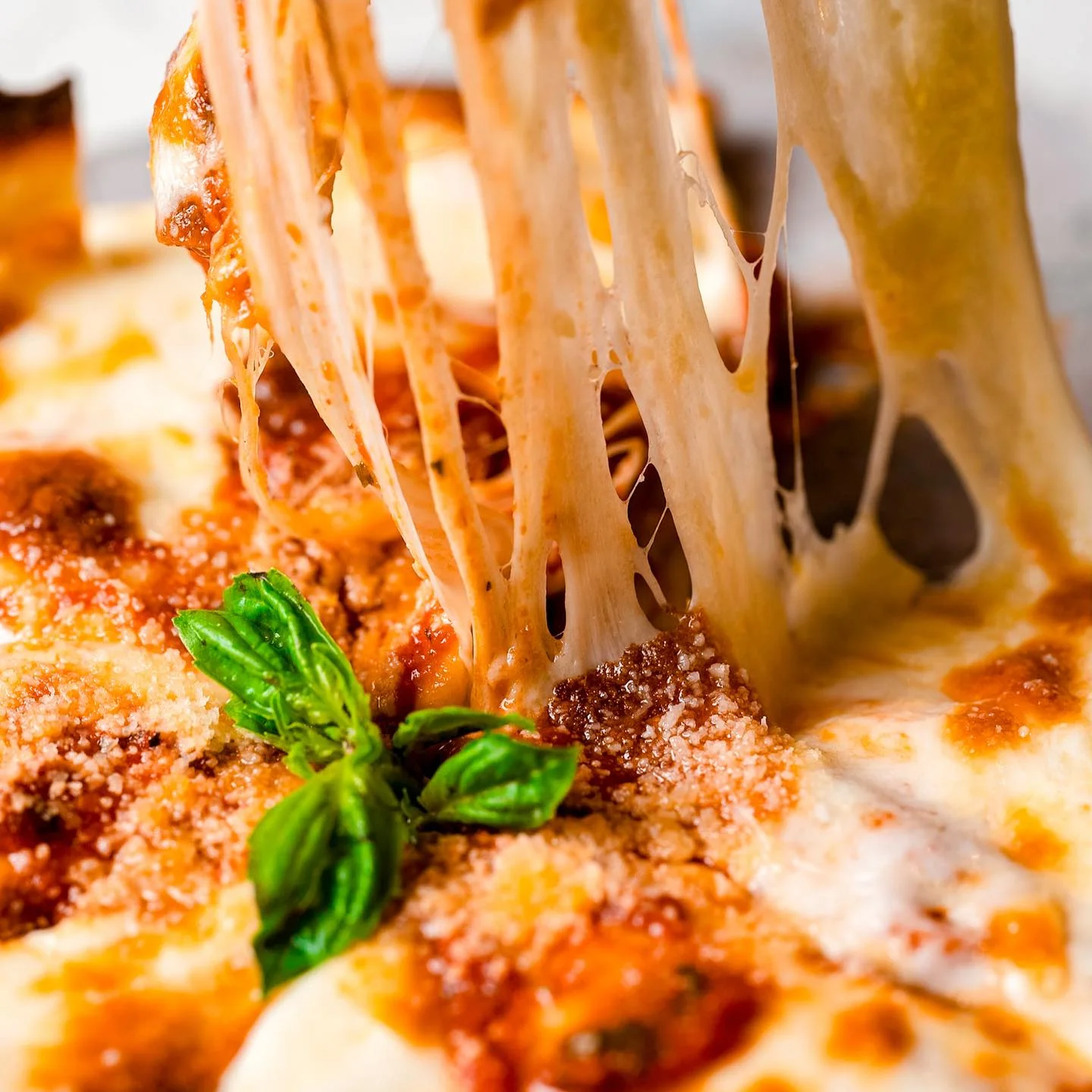 Cheesy lasagna with rich sauce and fresh basil