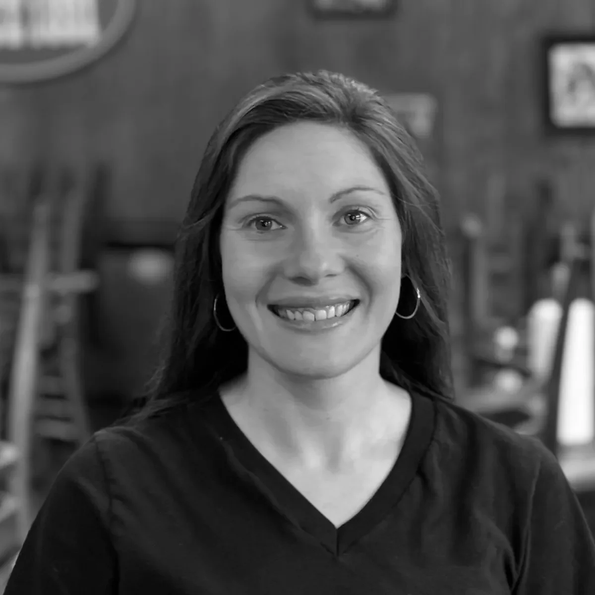 Smiling restaurant staff member in a cozy dining area
