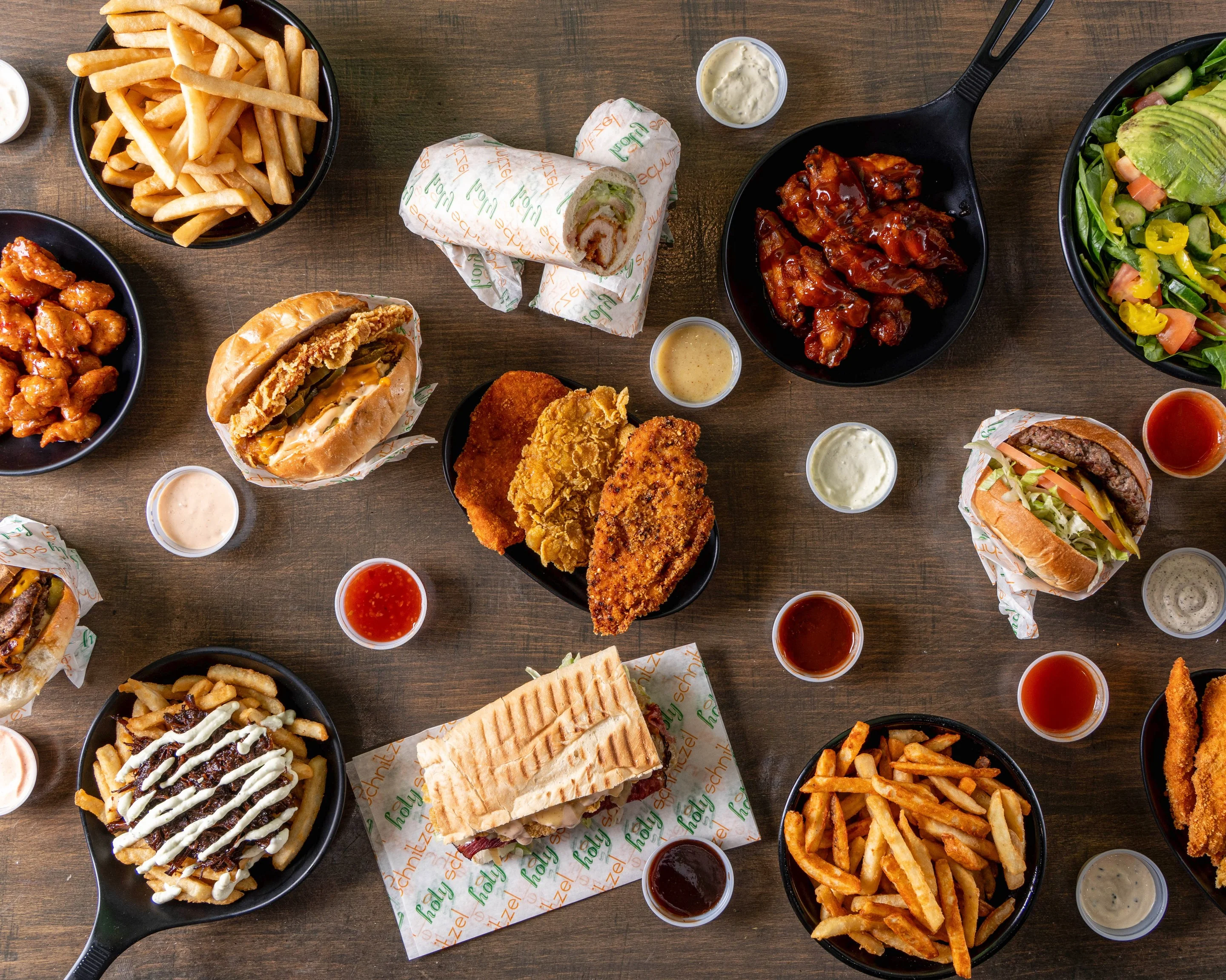 Assorted American comfort food platter with burgers and wings