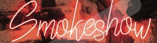 Neon sign reading 'Smokeshow' in a vibrant restaurant setting