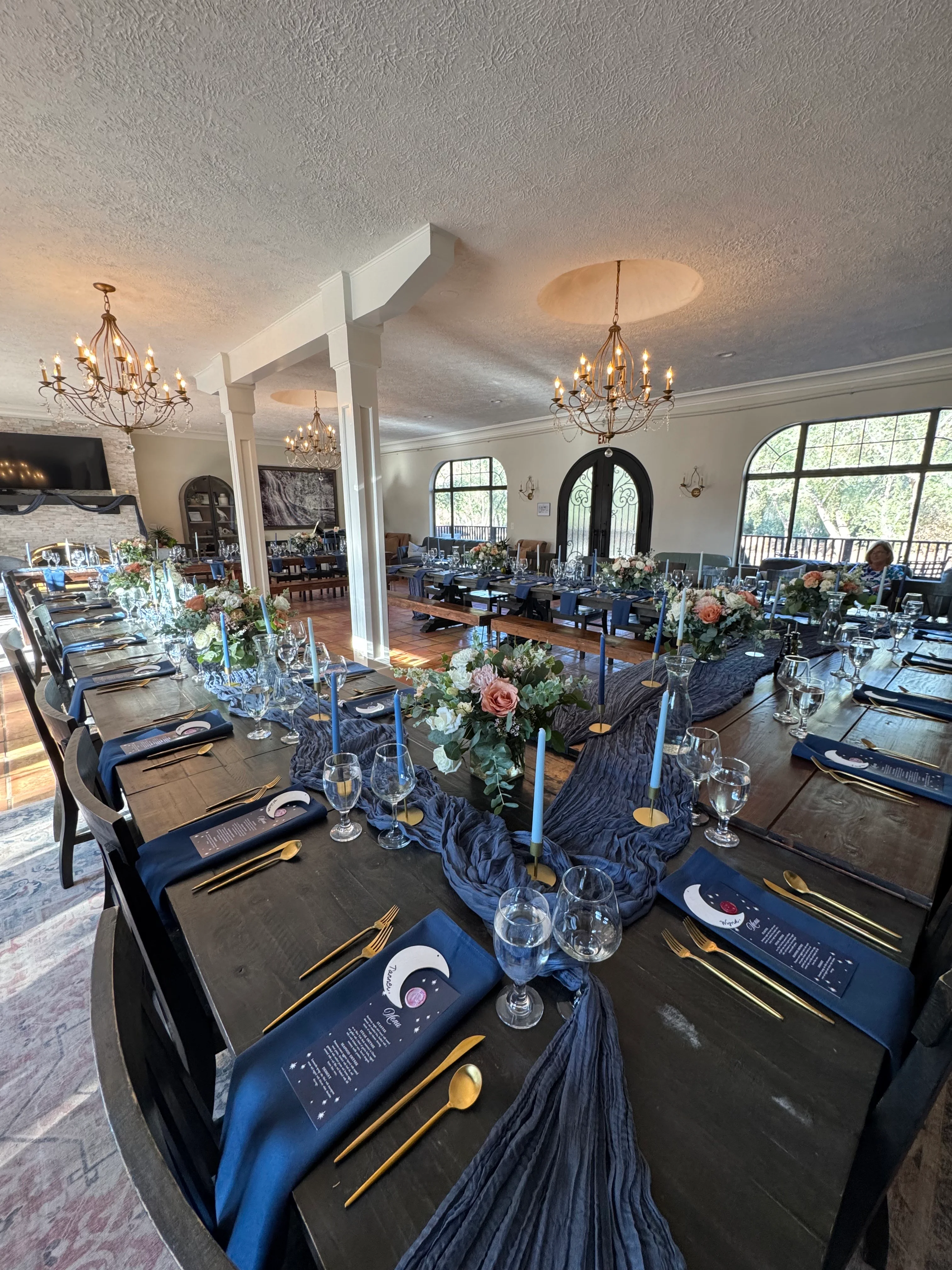 Elegant dining setup with floral arrangements and candles