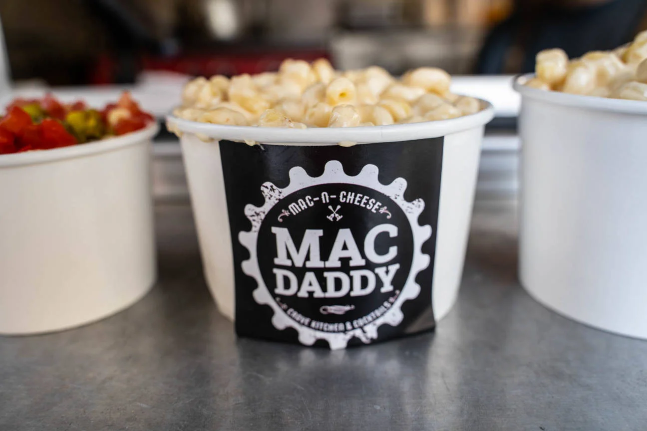 Creamy mac and cheese in a takeout cup