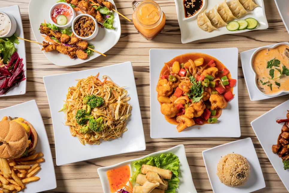 Assorted Asian dishes including sweet and sour chicken and fried rice
