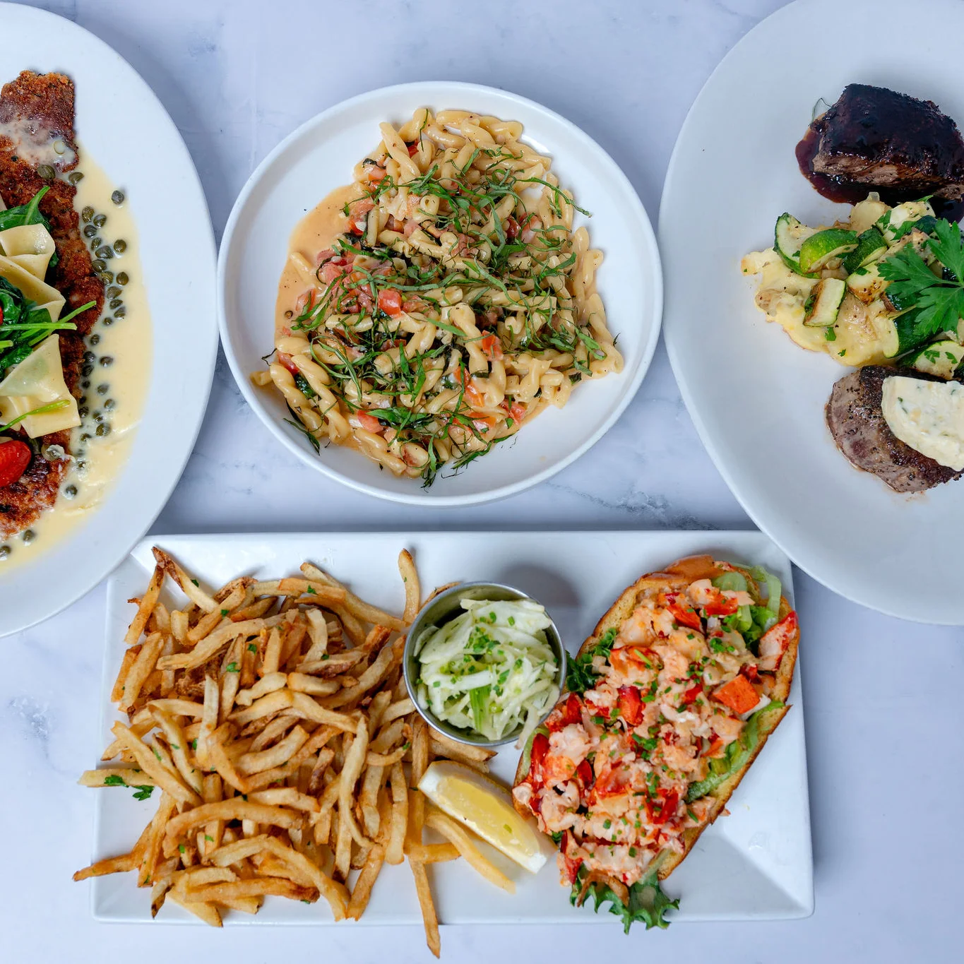 Grilled salmon with greens and sauce, served with macaroni and beef stew