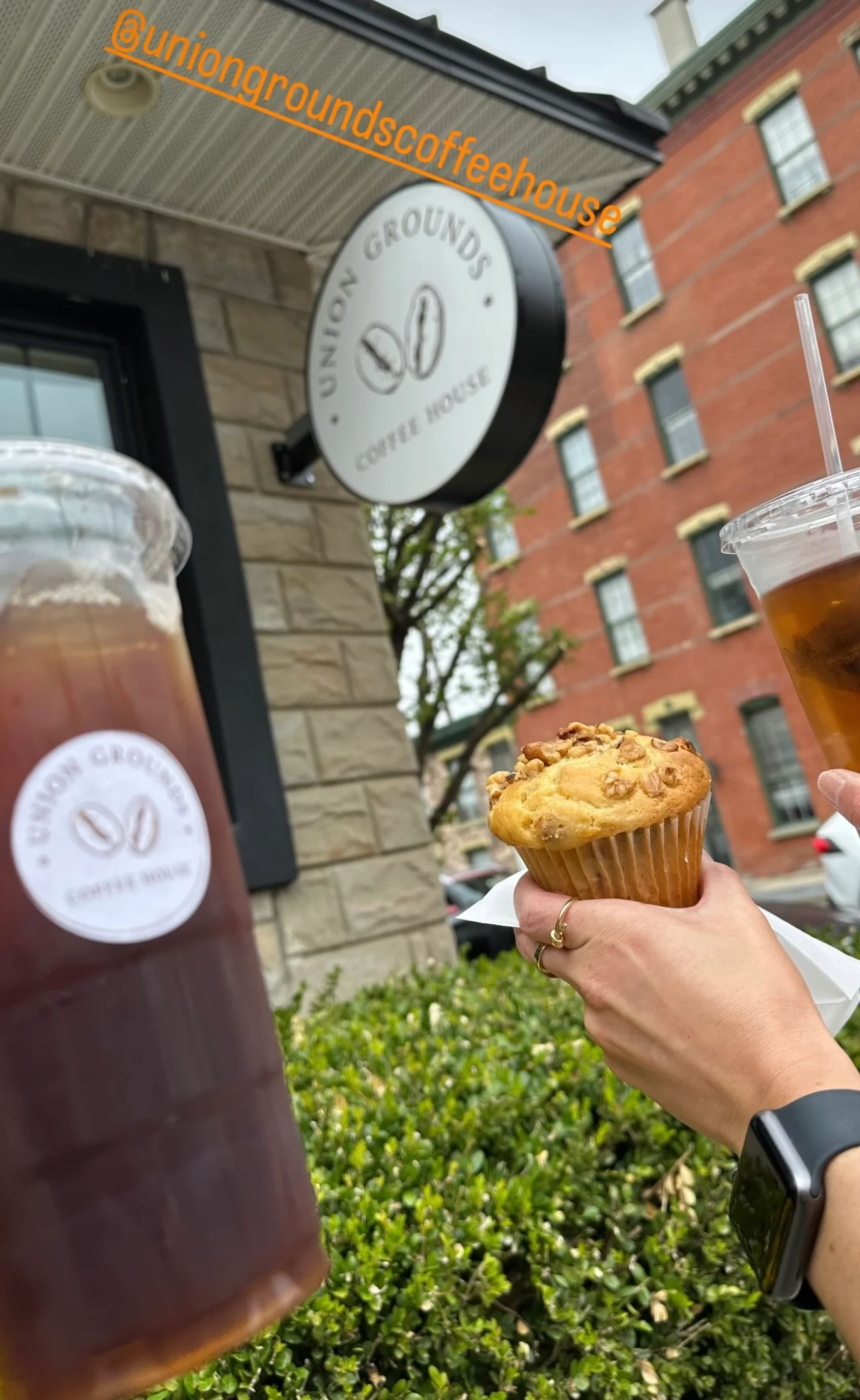 Iced coffee and muffin outside a coffee house
