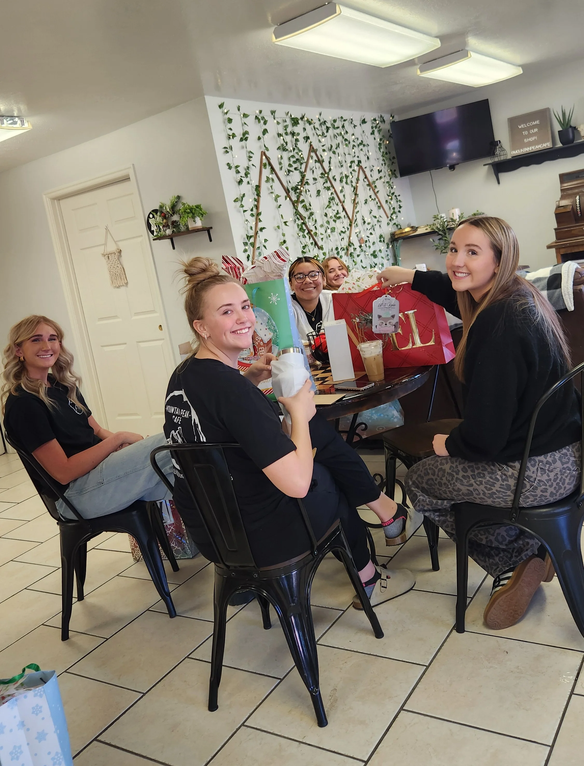 Group of friends enjoying a festive gathering in a cozy cafe