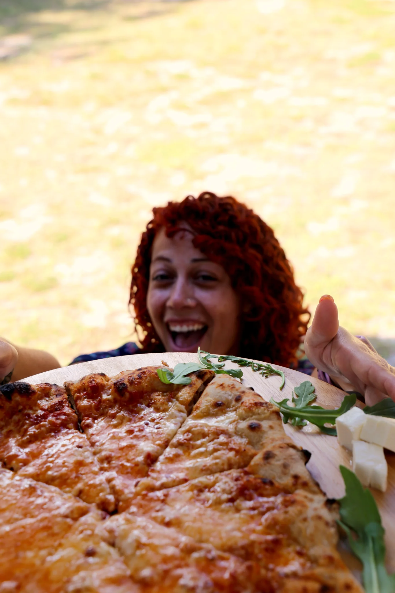 Delicious Margherita pizza served outdoors