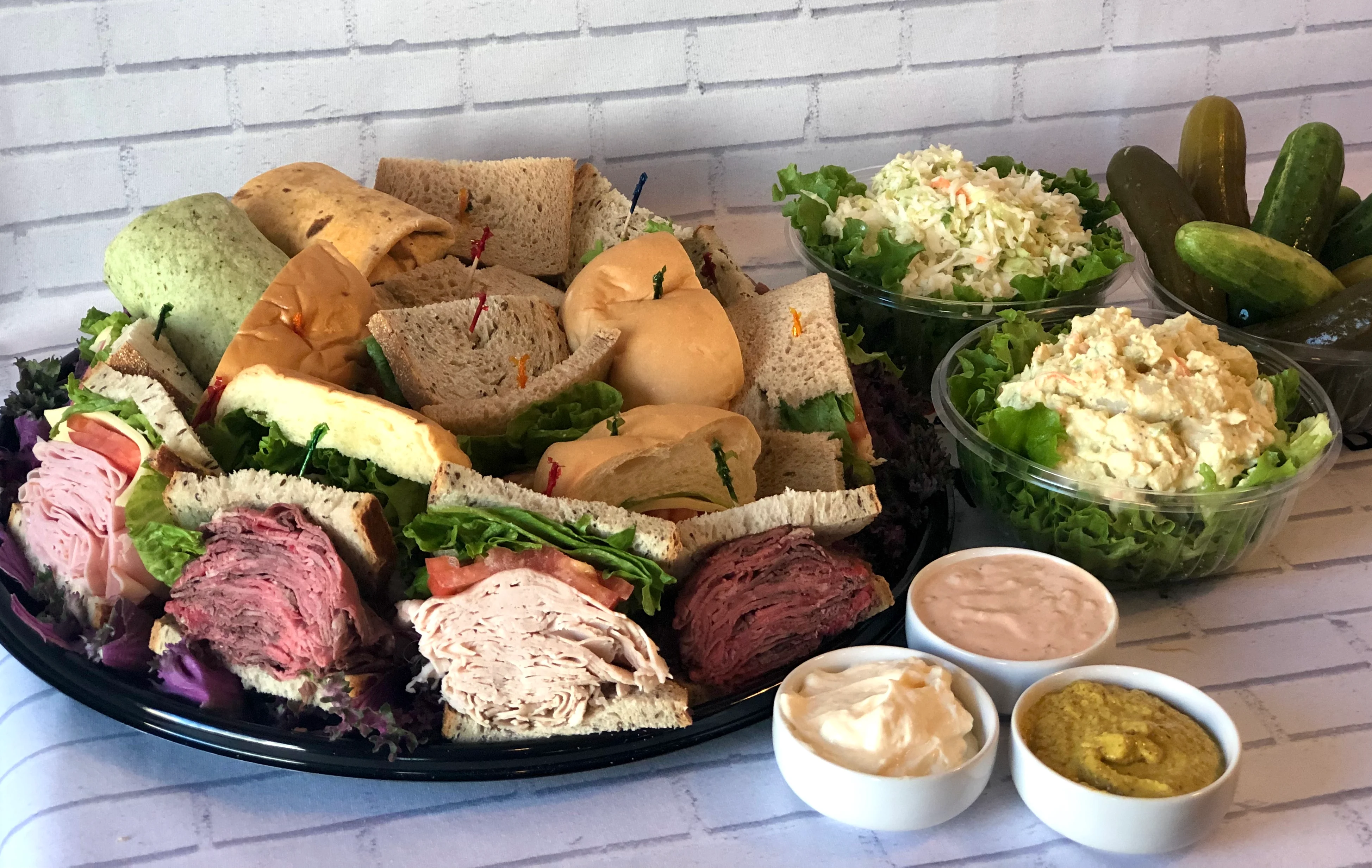 Box lunch with deli sandwich, chips, coleslaw, and cookie