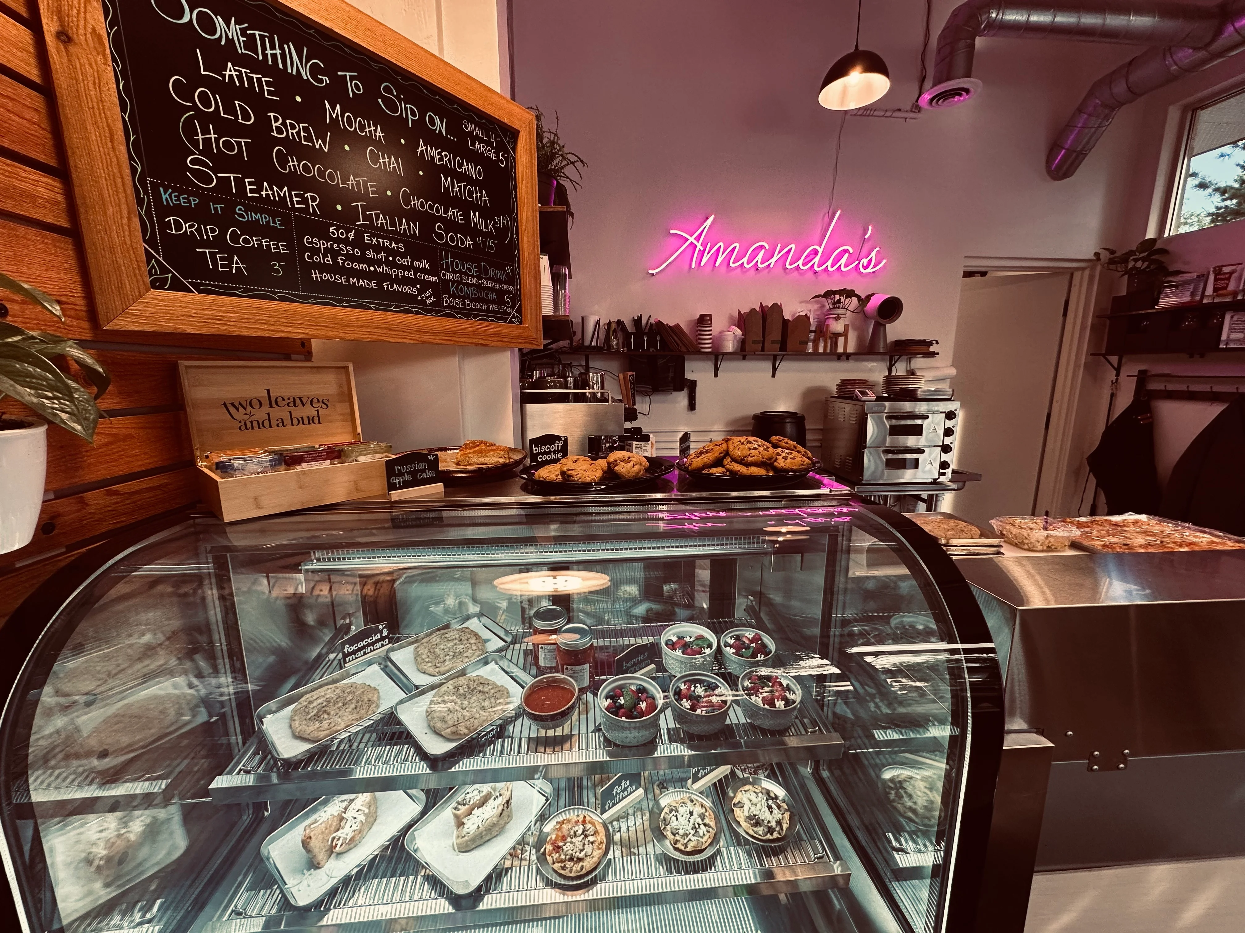 Cozy café interior with pastries and coffee menu