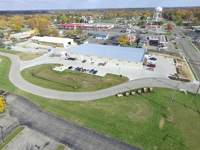 Aerial view of a modern commercial building and surrounding area
